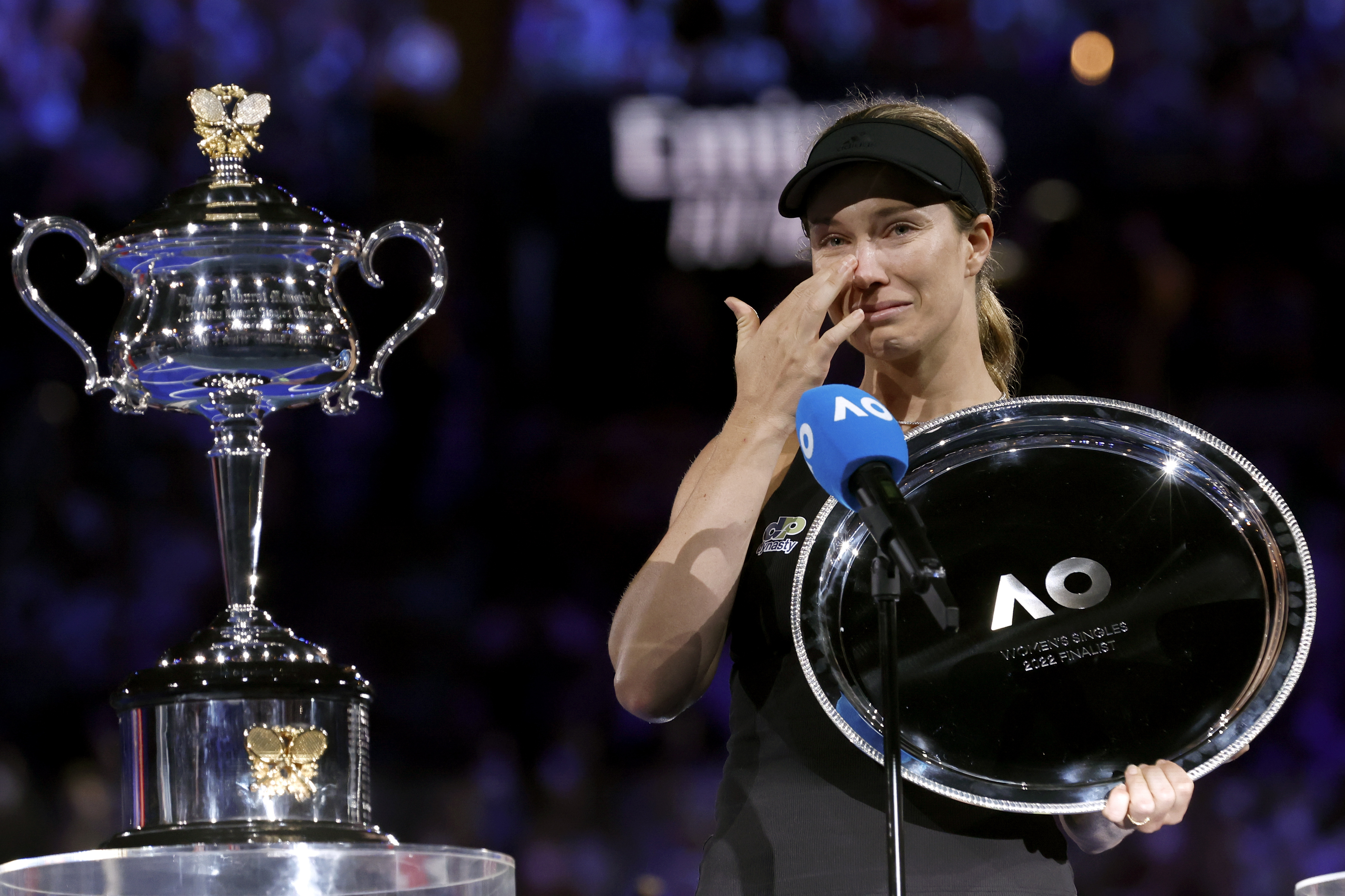 Danielle Collins reacts as she receives the runner-up trophy after losing to Ash Barty in the women's singles final at the Australian Open.