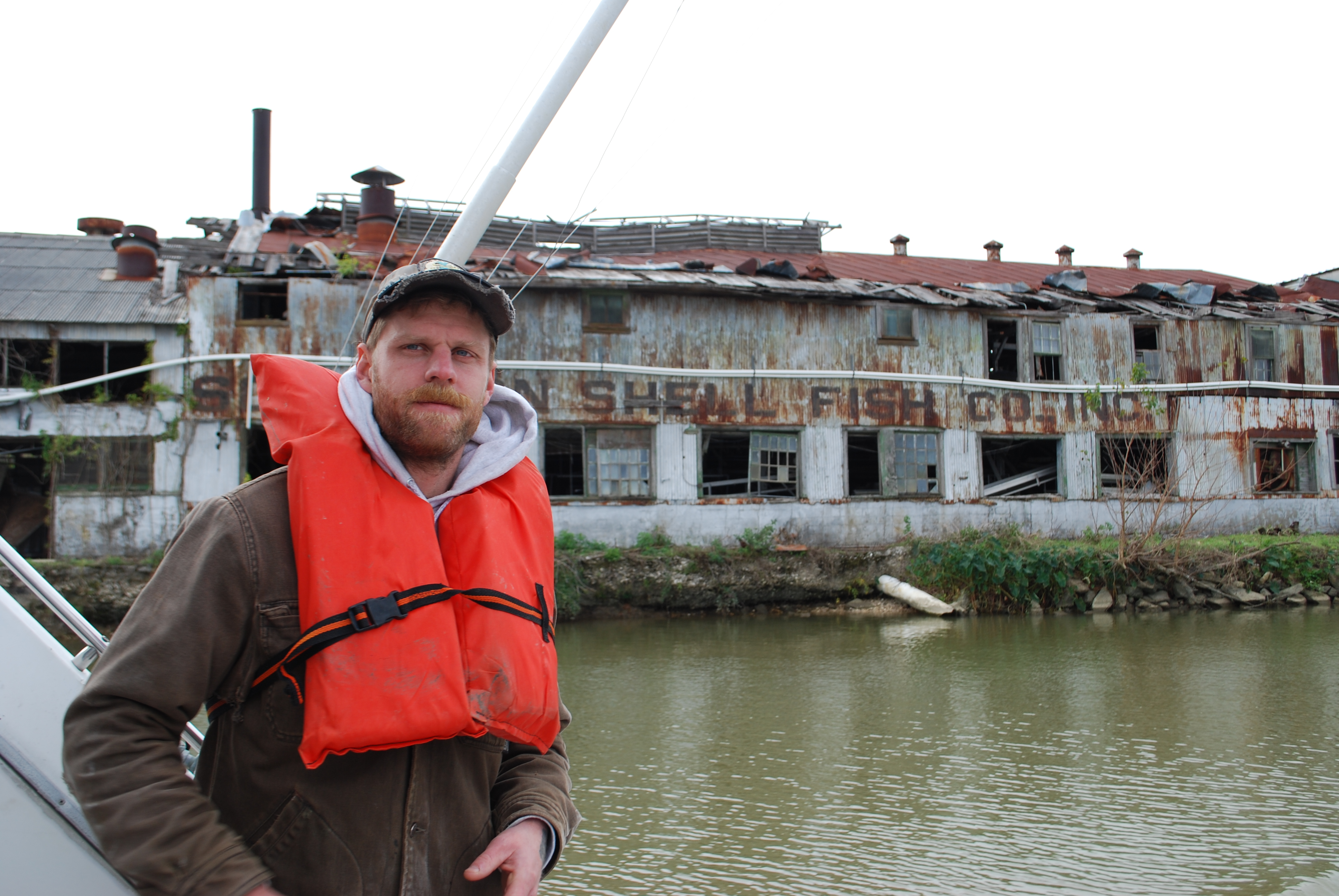 Lacava passes the crumbling warehouse of Southern Shell Fish Co., Inc.