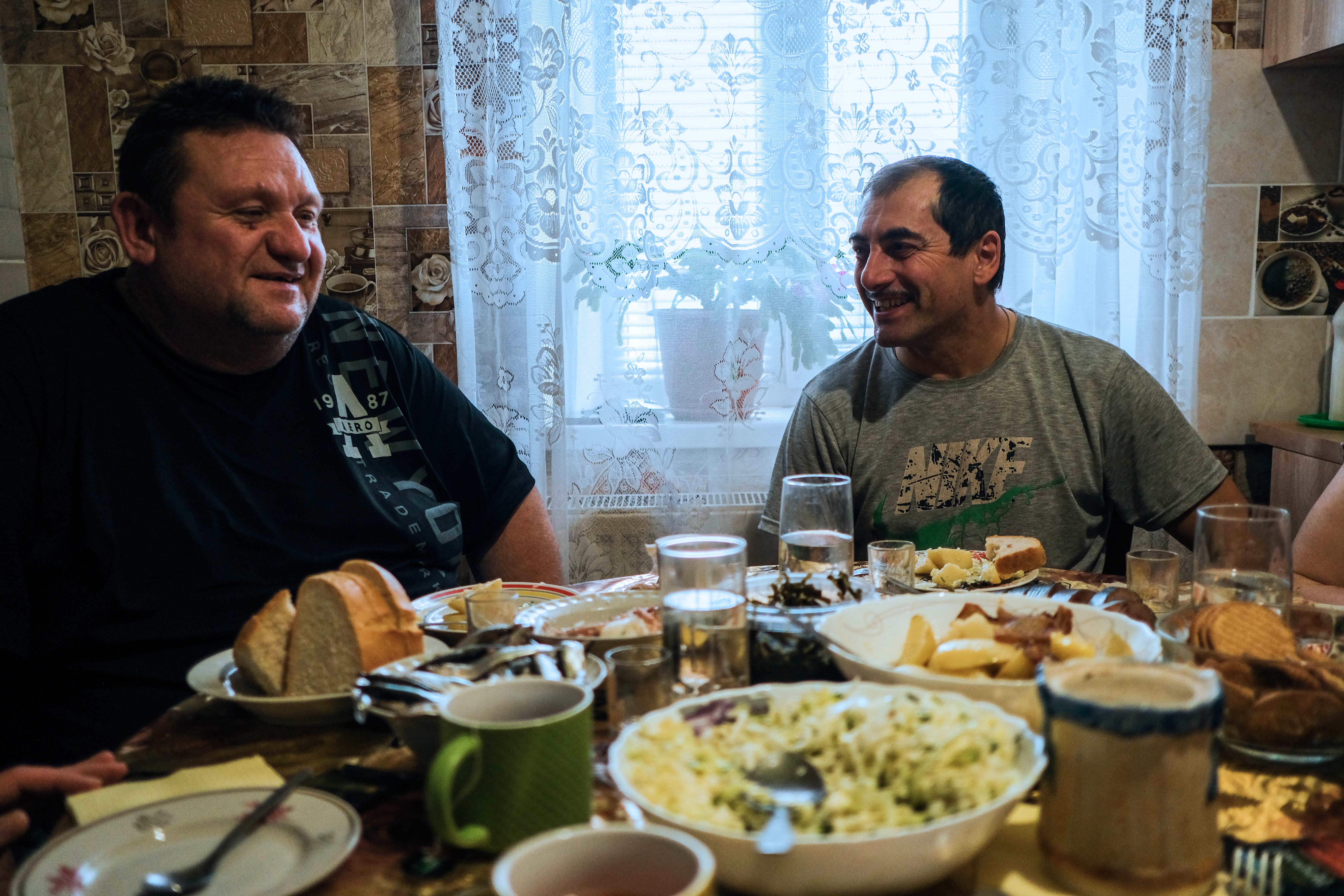 Sergie and his friend at the dinner table.