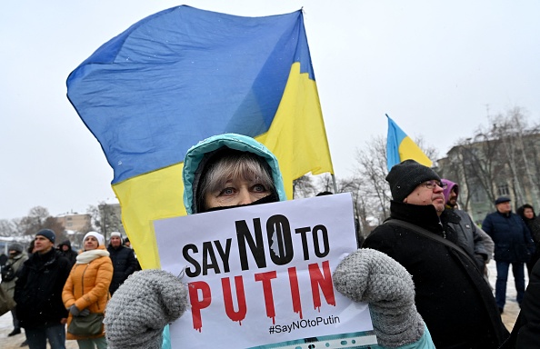 Demonstrators held placards and Kazakhstan flags in Kyiv, Ukraine.