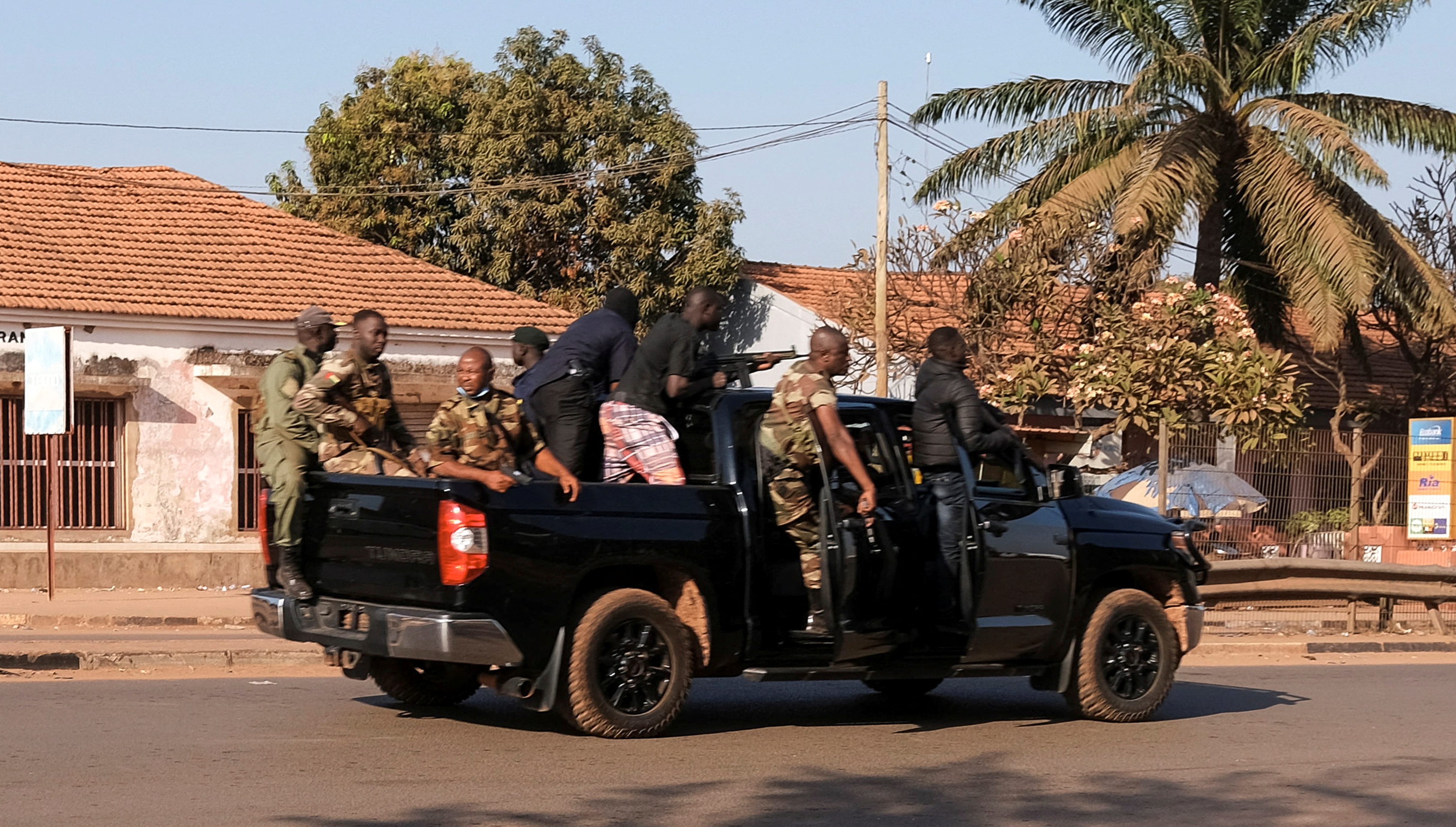 Armed soldiers move on the main artery of the capital after heavy gunfire around the presidential palace in Bissau, Guinea Bissau February 1, 2022