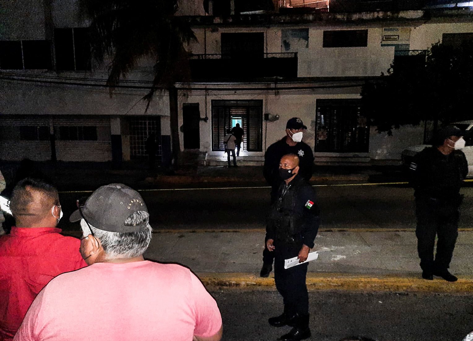 Police officers guard the perimeter of a scene where Heber Lopez, an independent journalist who ran NoticiasWeb, was shot dead at his recording studio