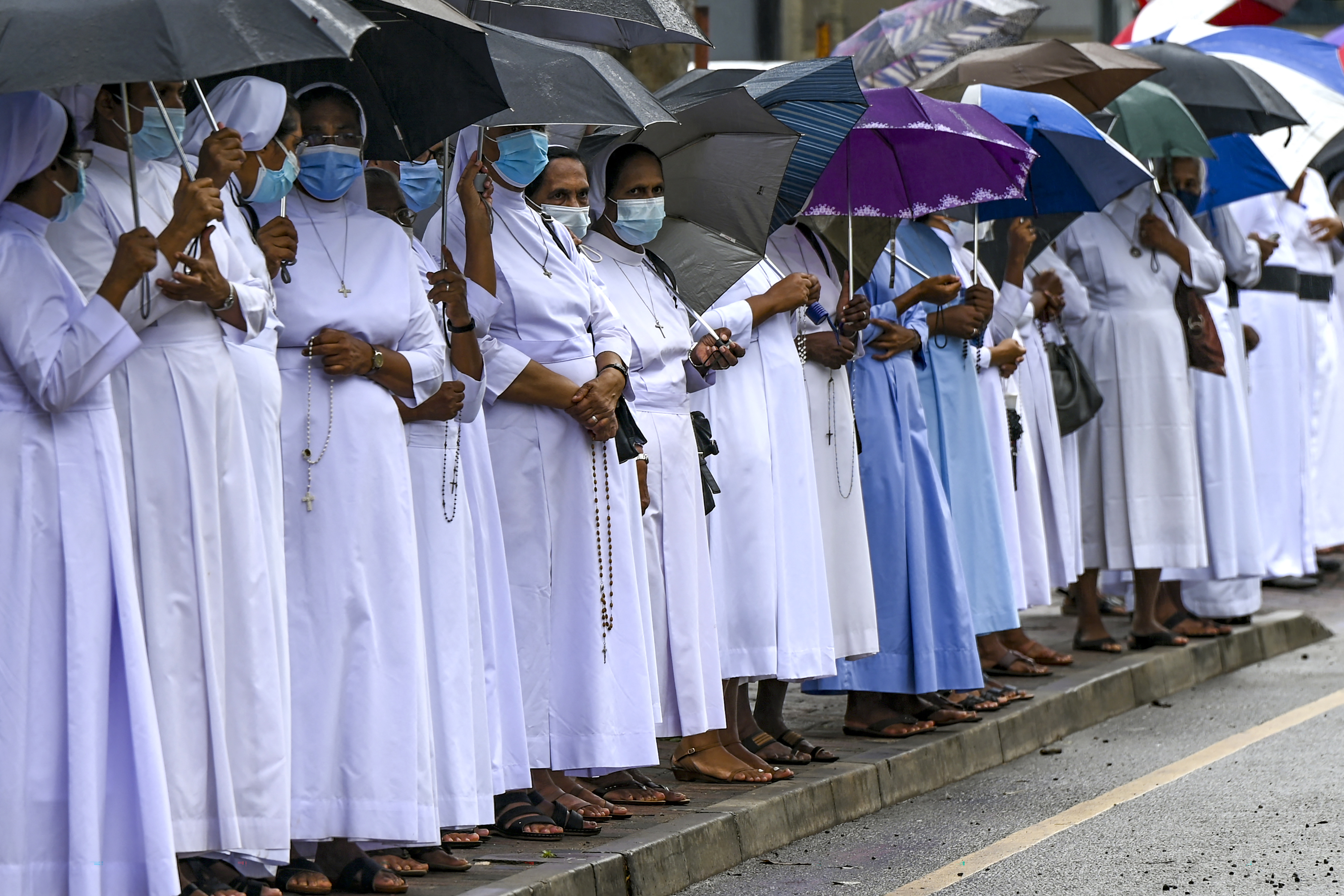 Catholic priests and nuns stage a silent protest outside the Sri Lanka's Supreme Court complex in Colombo