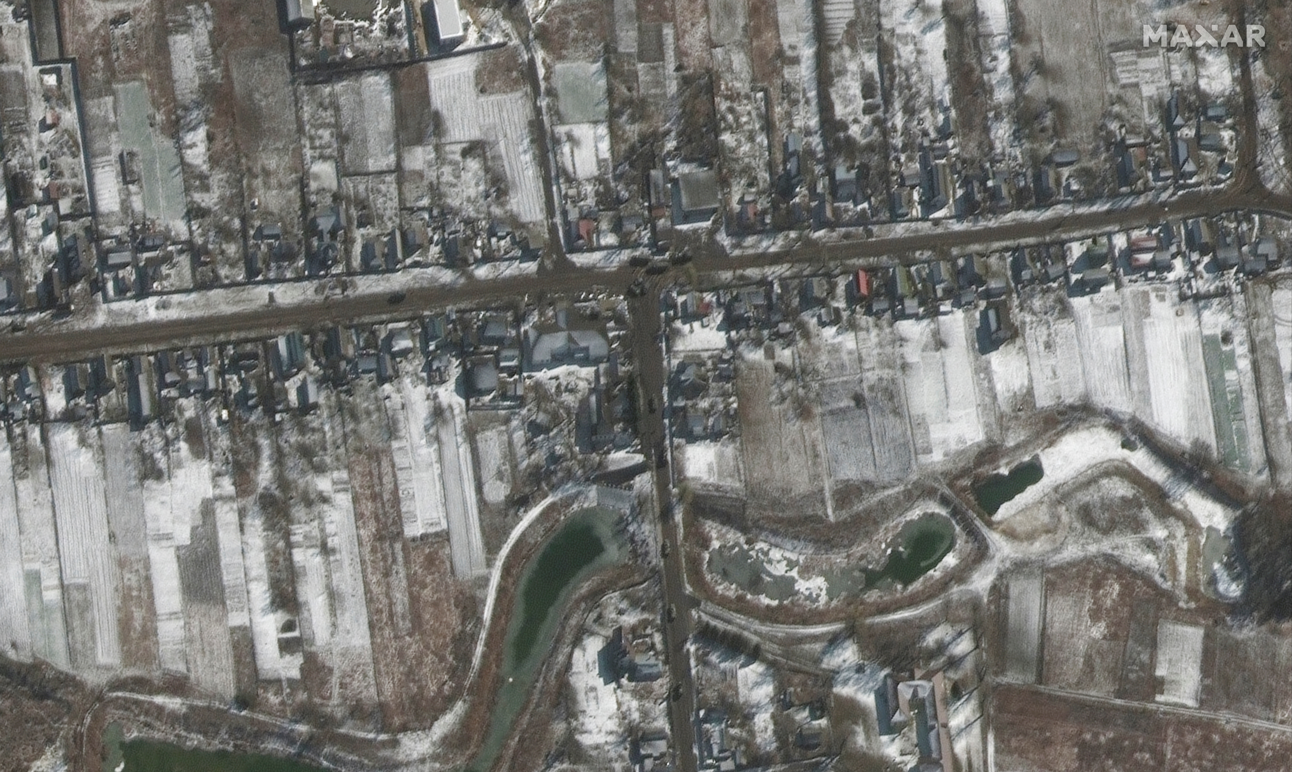 A satellite image shows troops and equipment deployed, amid Russia's ongoing invasion of Ukraine, in Ozera, northeast of Antonov Airport, Ukraine, March 10, 2022.