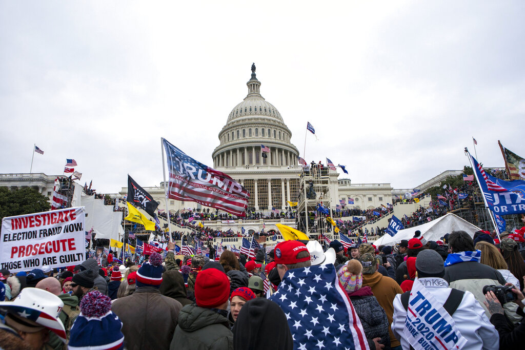 Thousands of people loyal to President Donald Trump swarmed the US Capitol, where police officers were attacked and beaten by the mob.