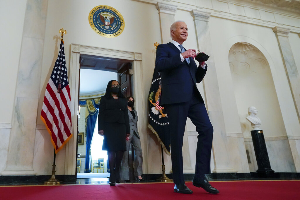 President Joe Biden, right, arrives with Vice President Kamala Harris and Judge Ketanji Brown Jackson, left, to announce Judge Ketanji Brown Jackson as his nominee to be an Associate Justice of the U.S. Supreme Court at the White House.