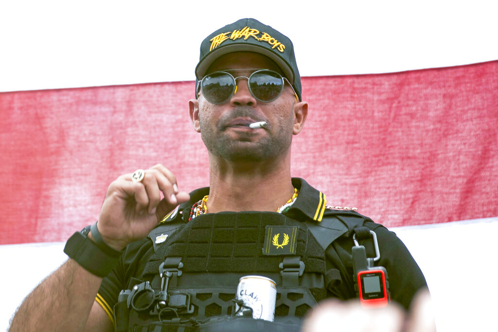 Proud Boys leader Henry "Enrique" Tarrio wears a hat that says The War Boys during a rally in Portland, Oregon.