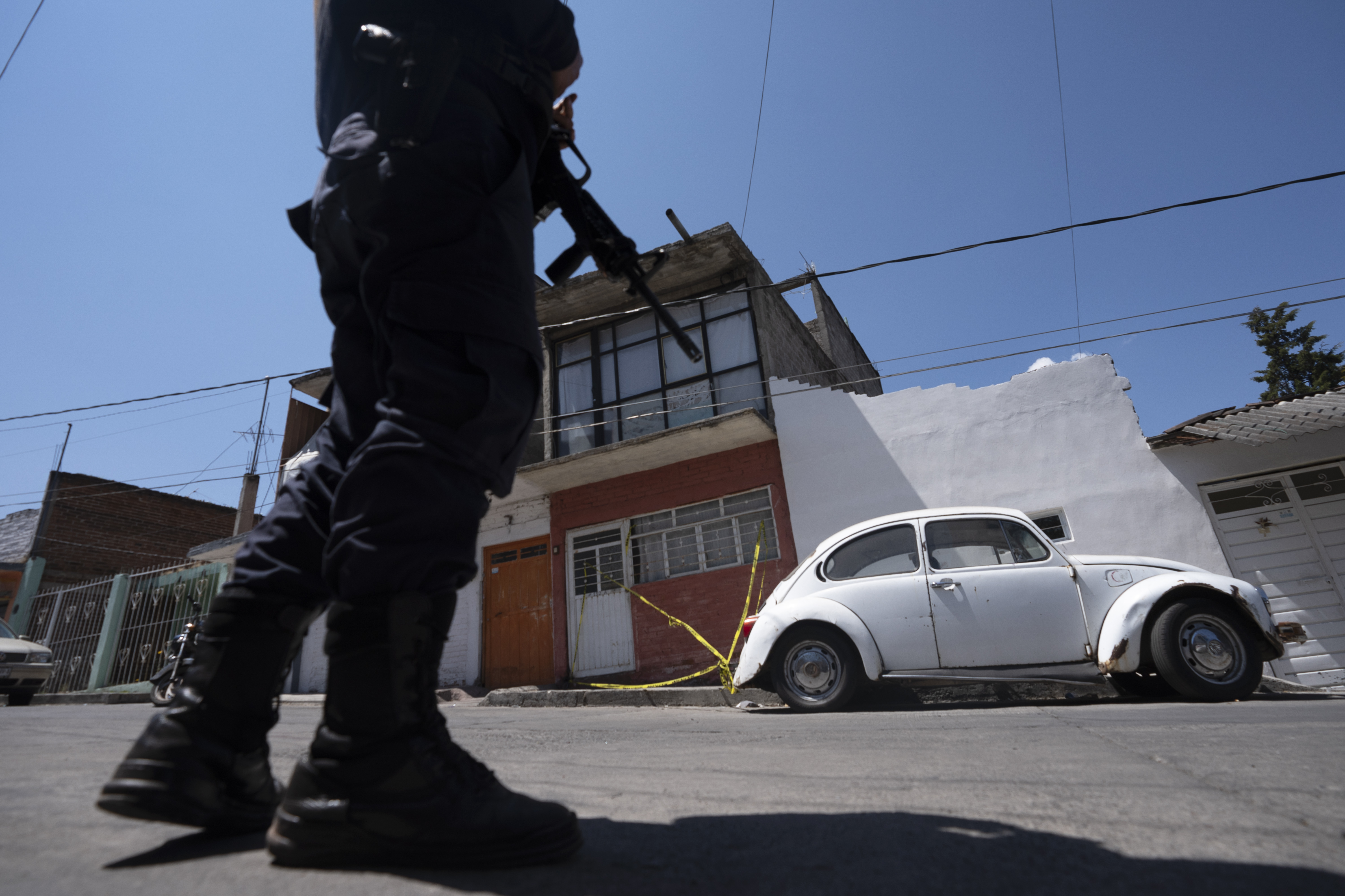 Police officer standing and holding gun