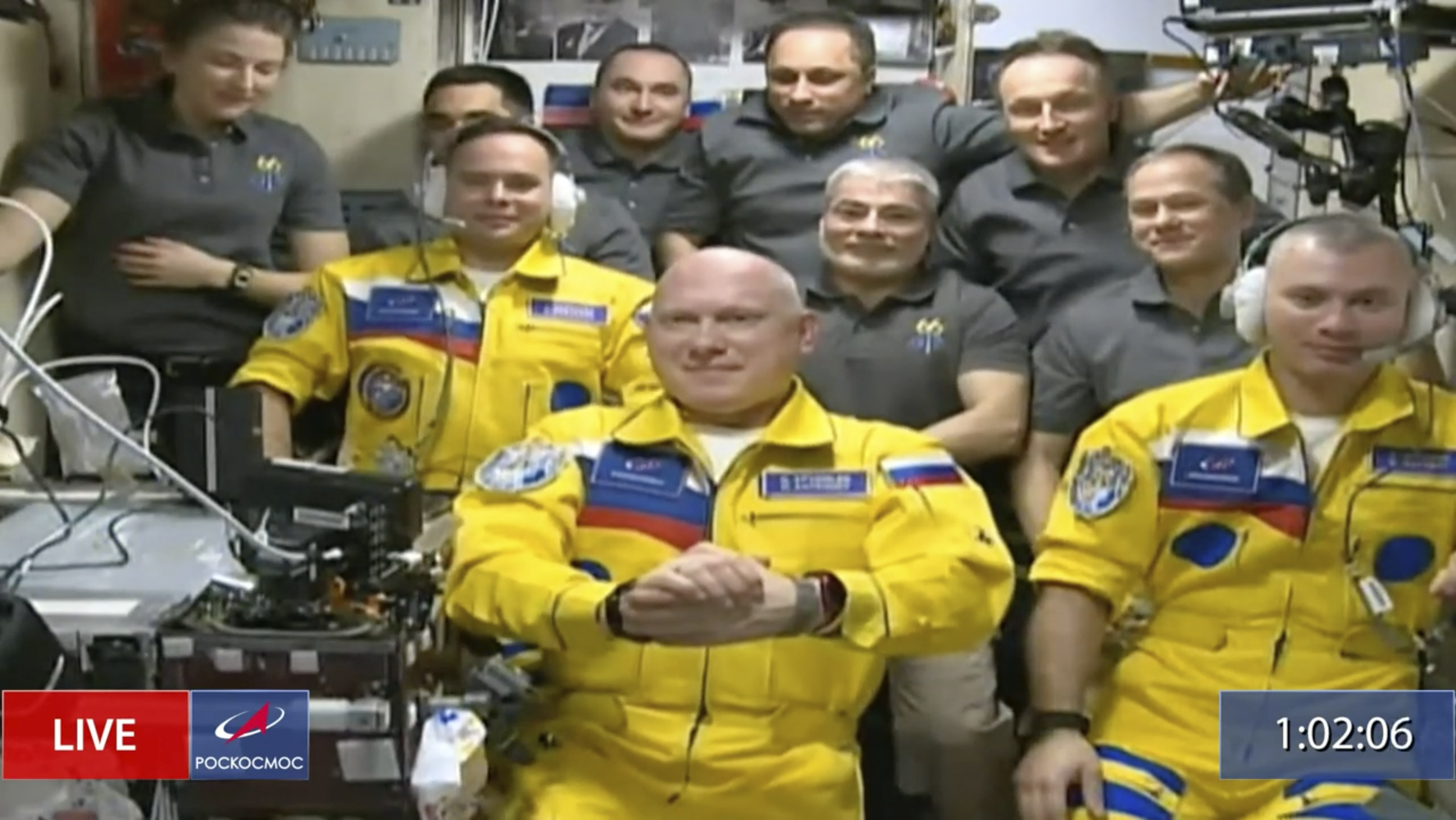 In this frame grab from video provided by Roscosmos, Russian cosmonauts Sergey Korsakov, Oleg Artemyev and Denis Matveyev are seen during a welcome ceremony after arriving at the International Space Station, Friday, March 18, 2022, the first new faces in space since the start of Russia’s war in Ukraine.
