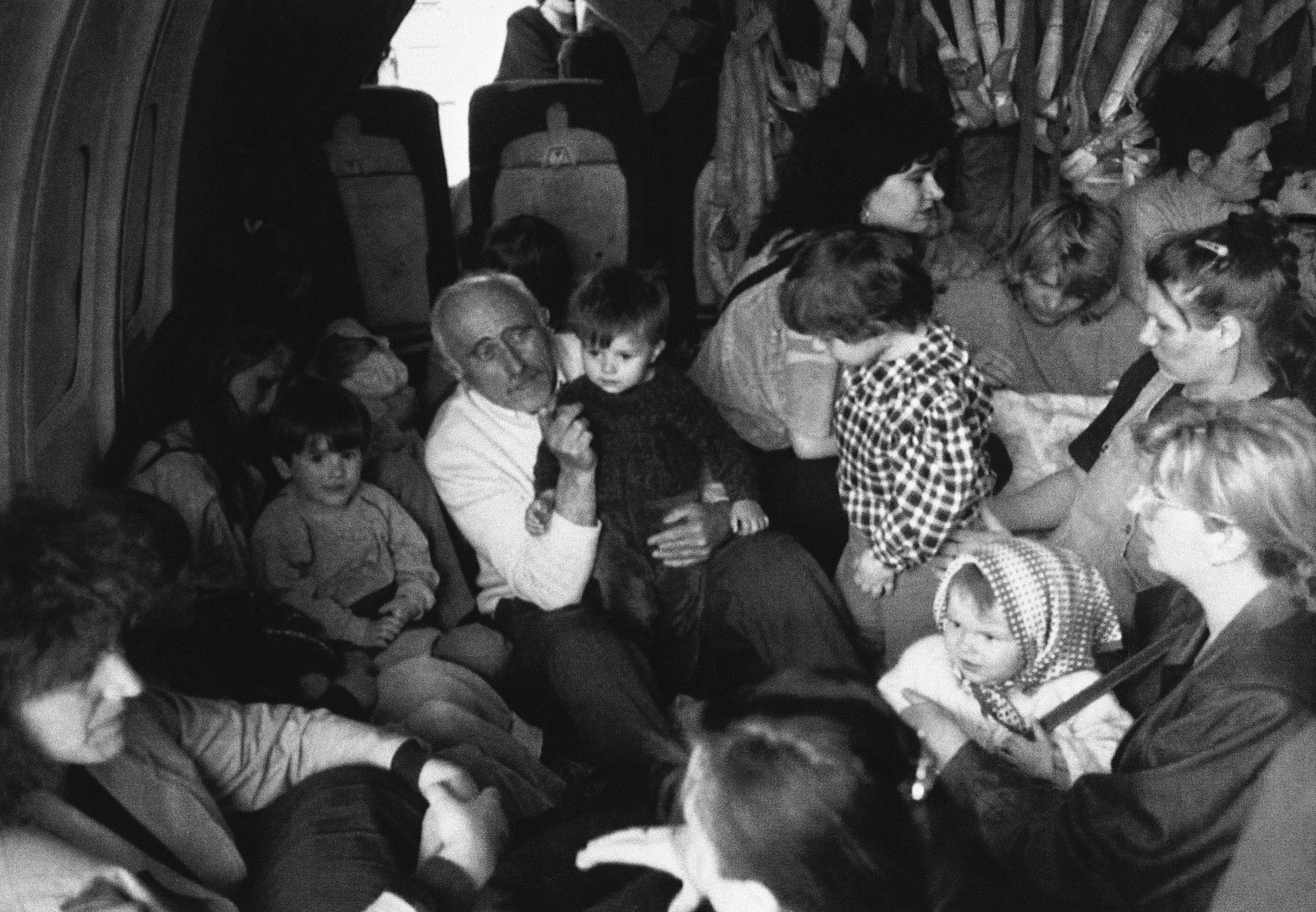 Refugees on a plane fleeing fighting in Bosnia-Herzegovina in 1992