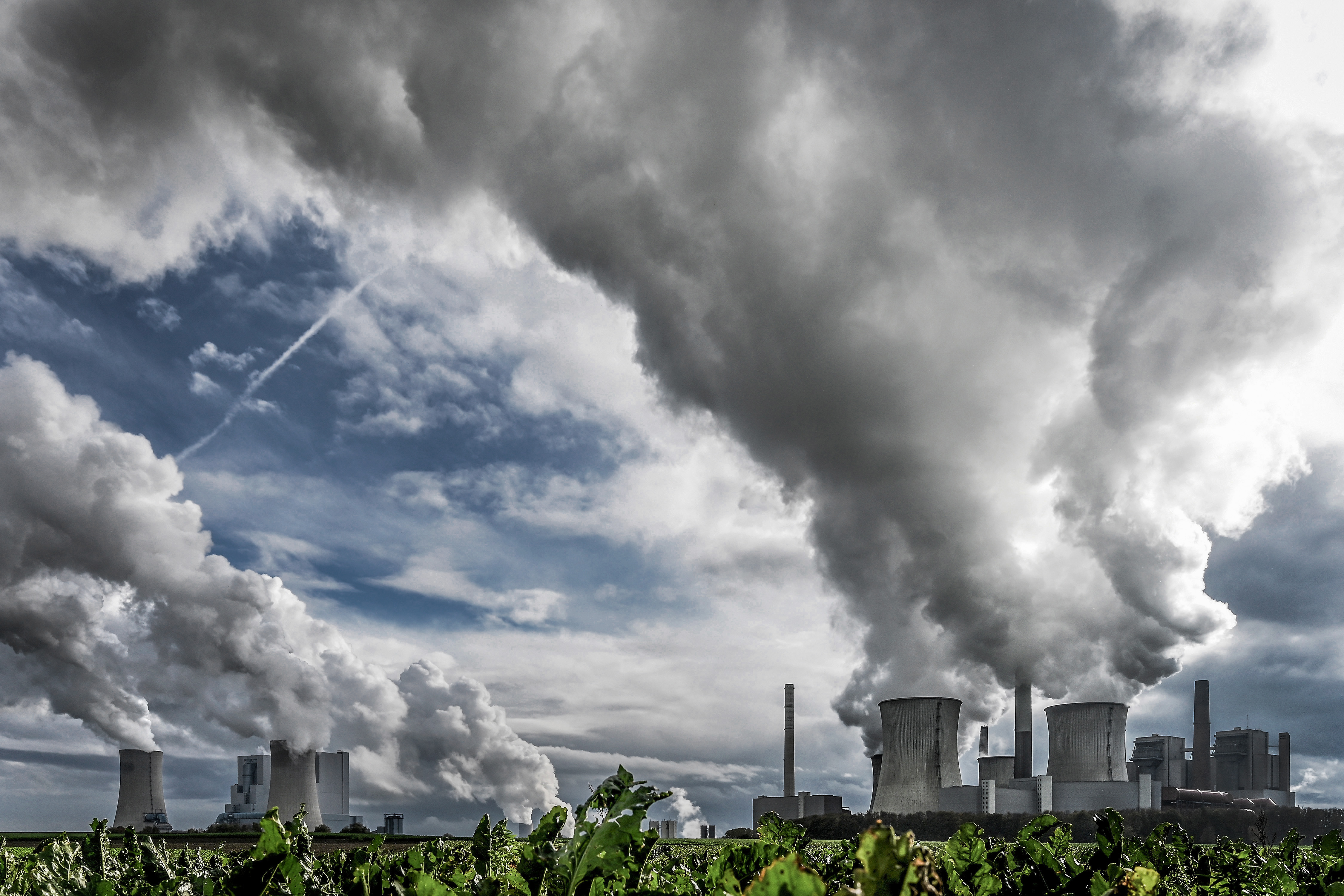 Steam rises from the lignite-fired power plants Neurath and Niederaussem operated by German energy supplier RWE near Grevenbroich, Germany