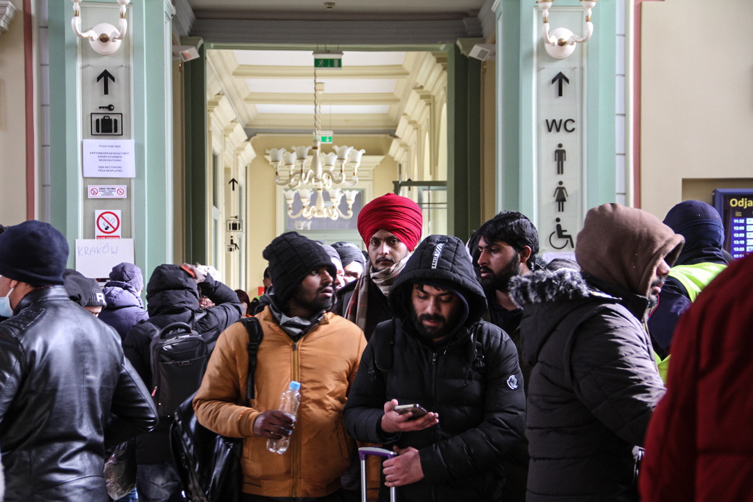 Refugees wait inside Przemysl train station across the border with Ukraine