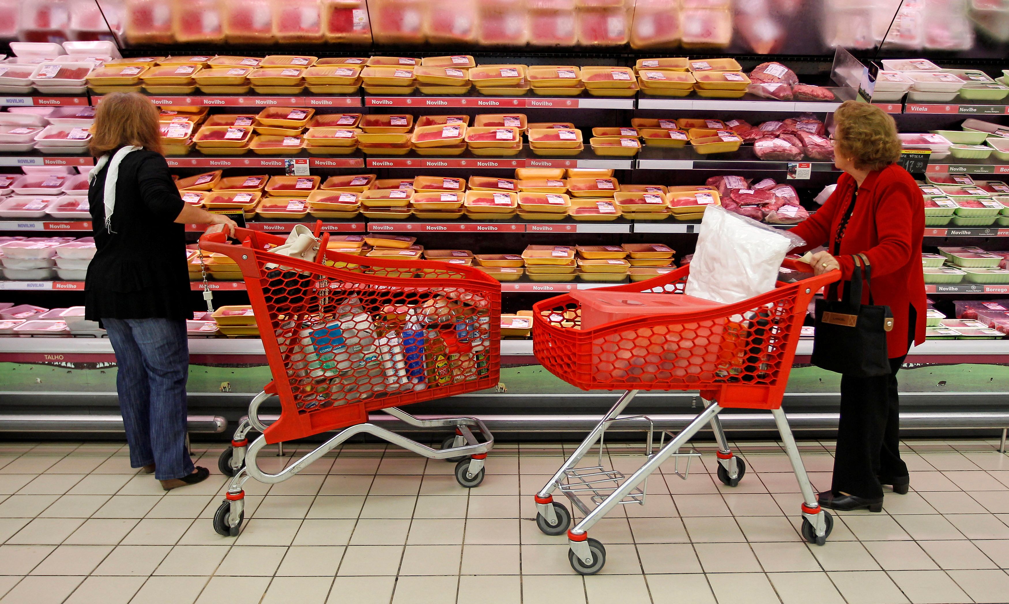 Women shop in a supermarket in Lisbon
