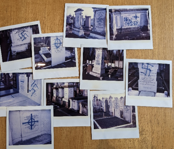 Polaroids showing graffiti desecrating Jewish graves in various cemeteries around England.