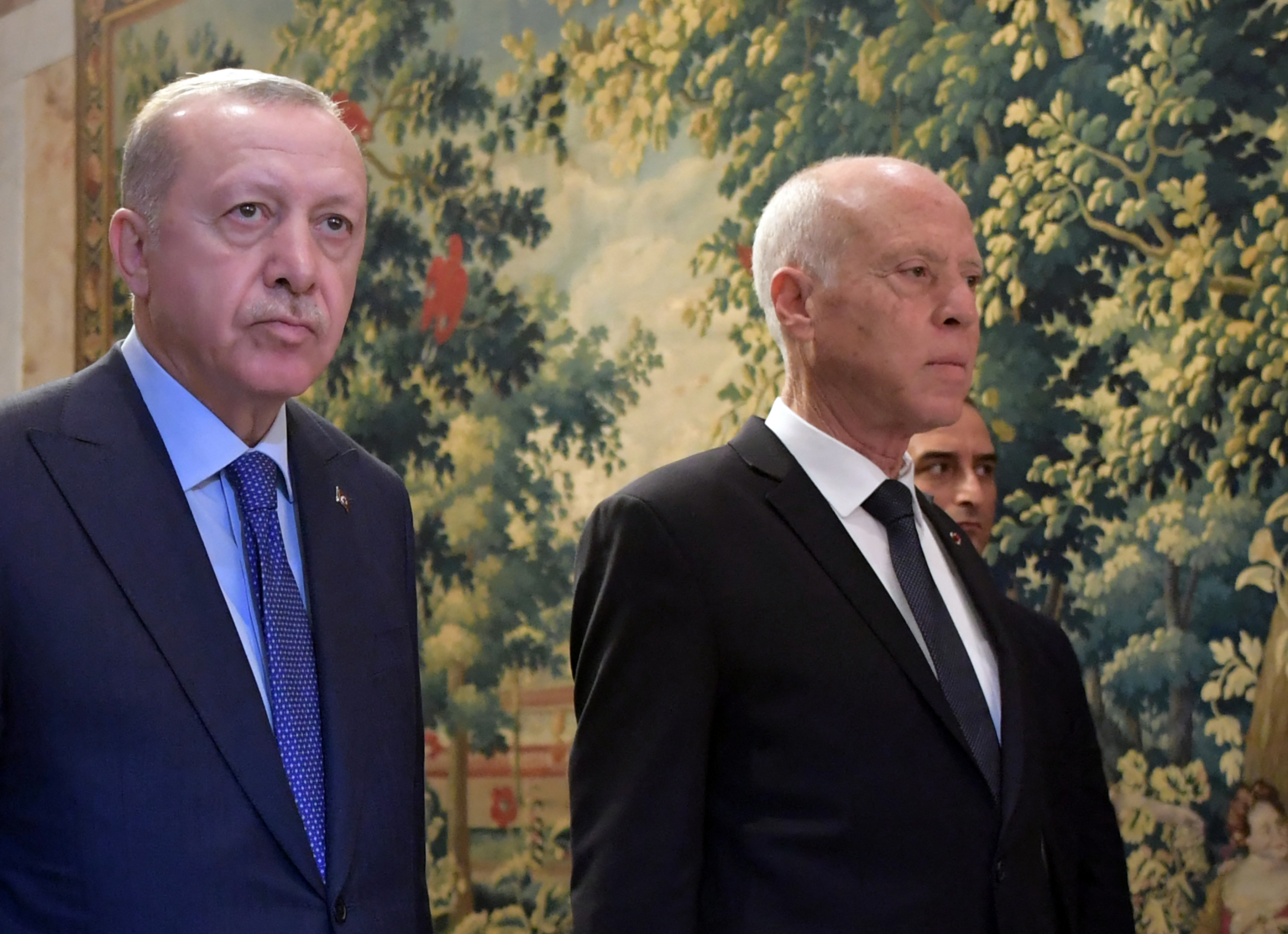 Tunisian President Kais Saied arrives with Turkish President Recep Tayyip Erdogan for a joint press conference at the presidential palace in Carthage.