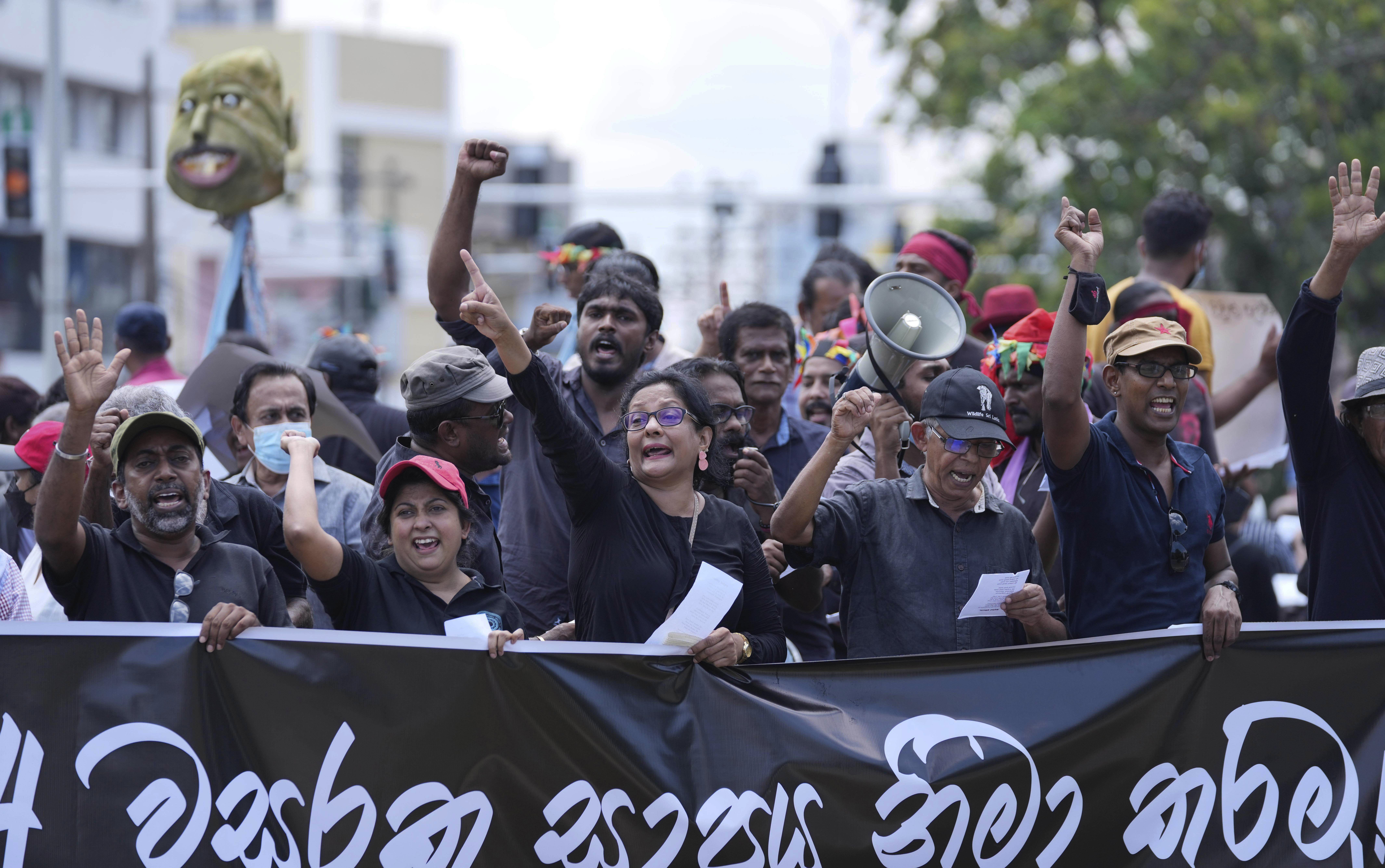 Sri Lankans protest demanding president Gotabaya Rajapaksa resign, in Colombo, Sri Lanka, Tuesday, April 5, 2022.