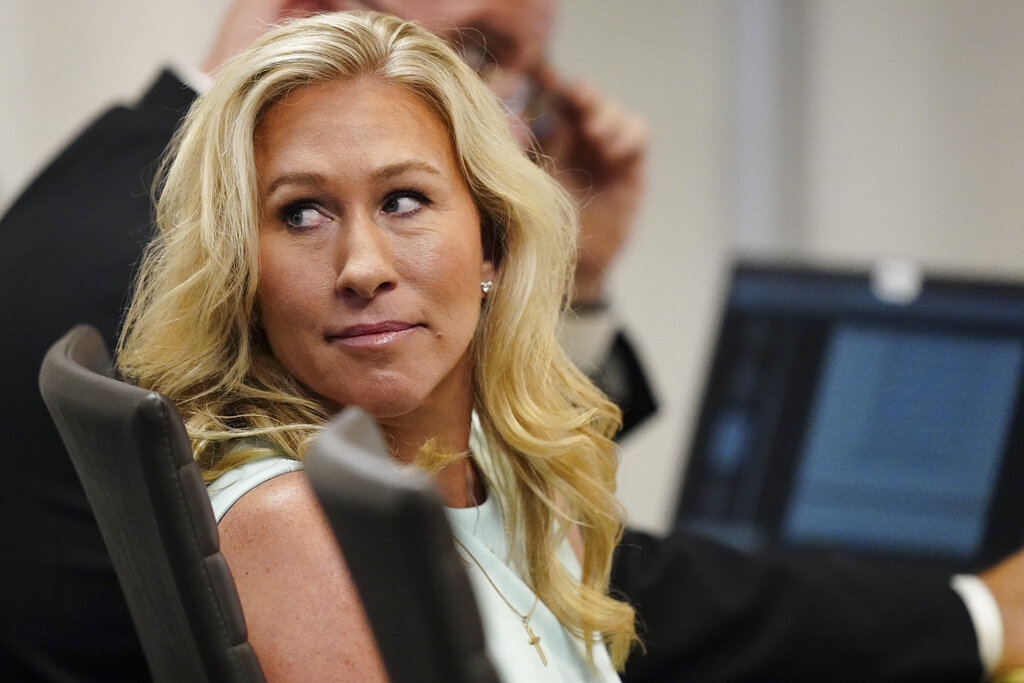 U.S. Rep. Marjorie Taylor Greene sits in the courtroom.