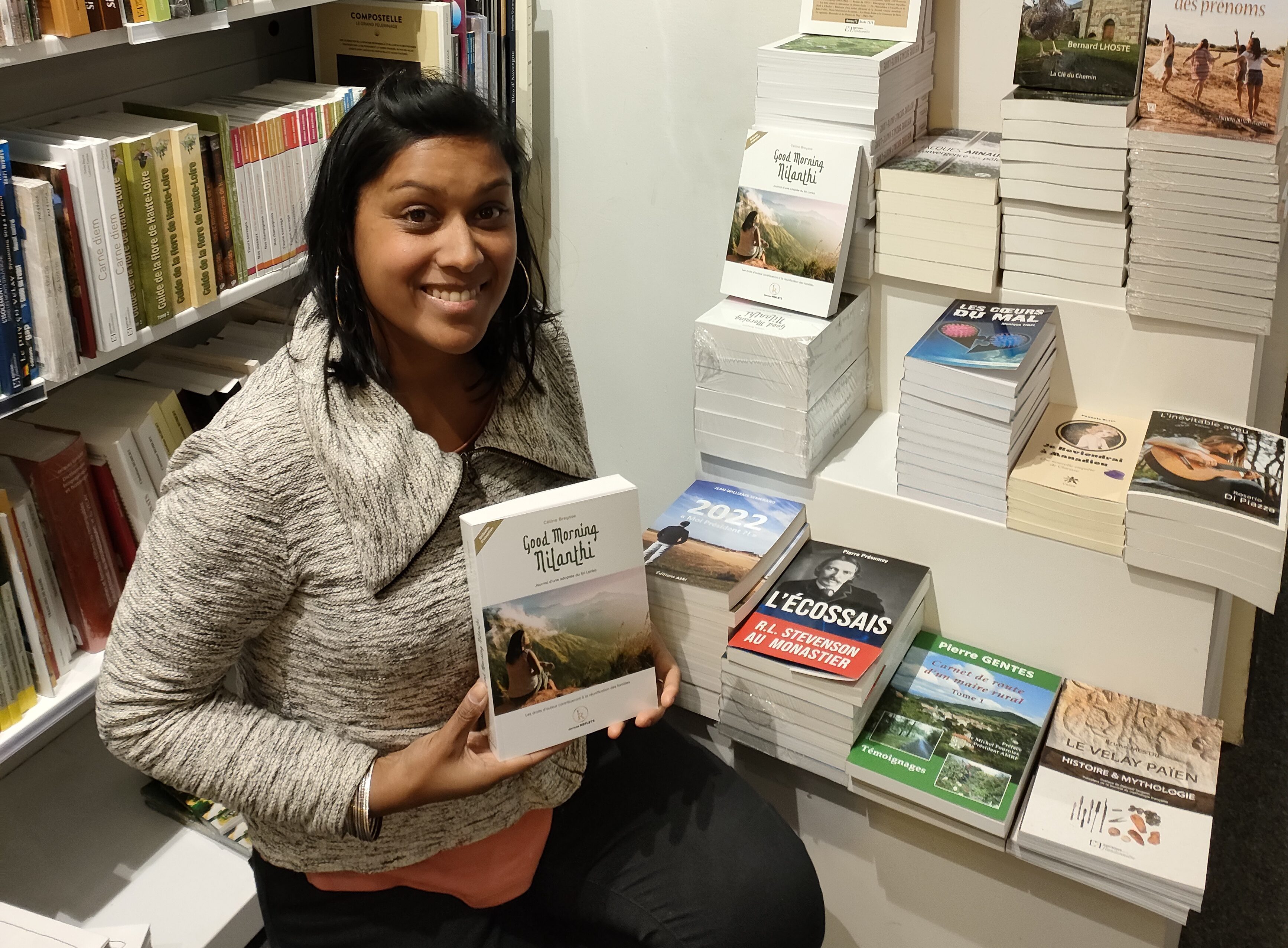 A woman holds a book