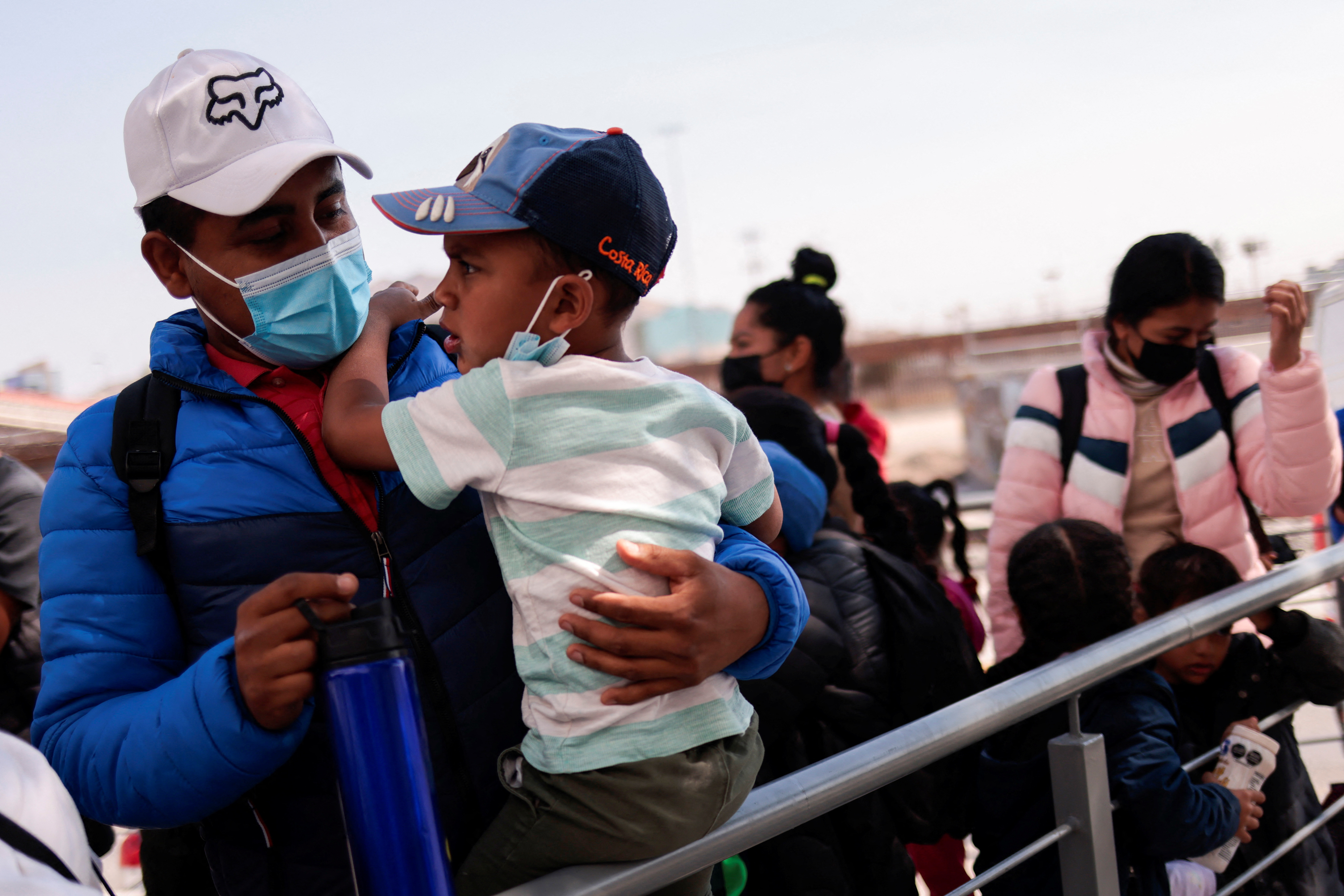 A family waits in Mexico near the US border