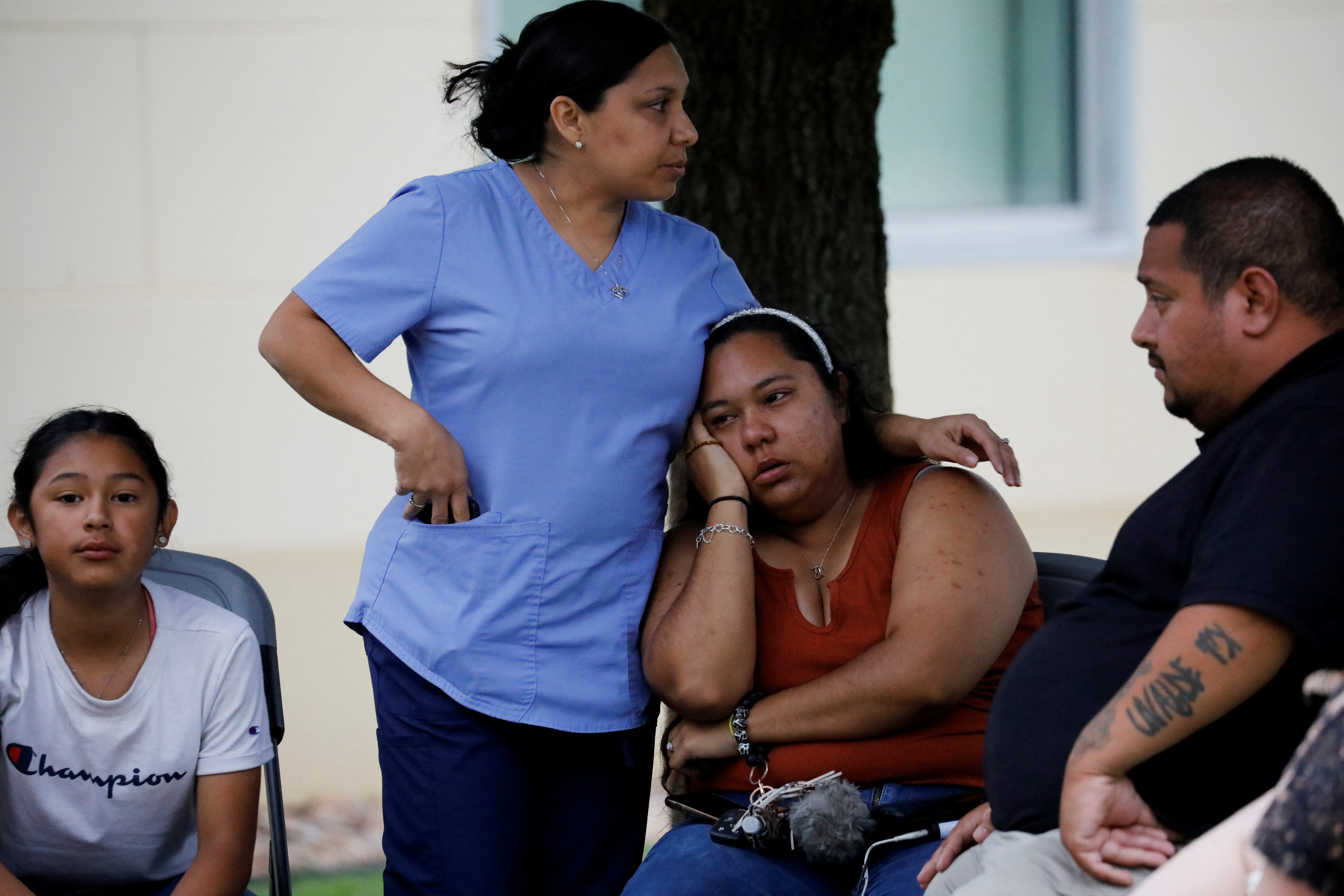 People react outside the Ssgt Willie de Leon Civic Center