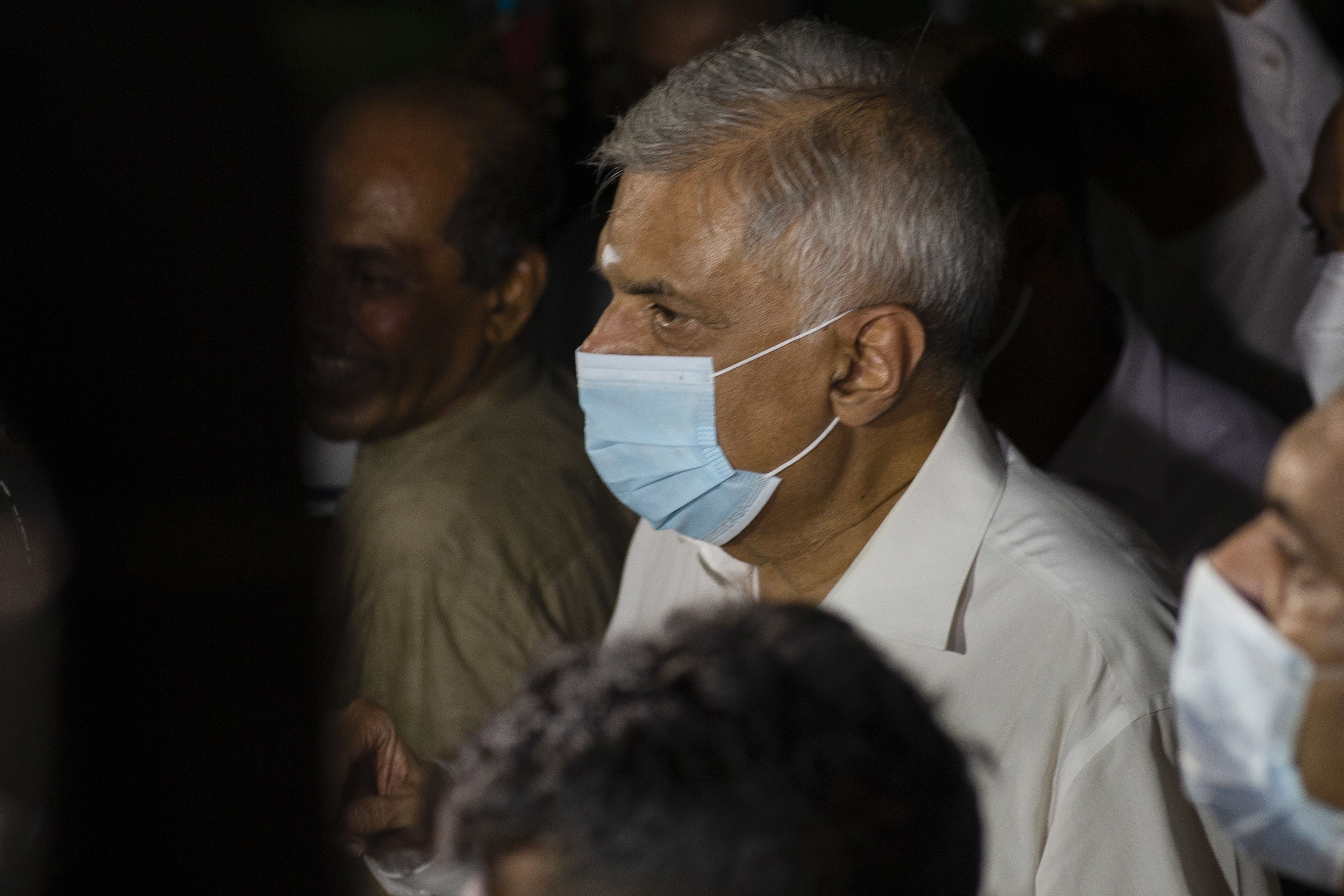 Ranil Wickremesinghe, newly-appointed Prime Minister of Sri Lanka, visits a Buddhist temple in Colombo, Sri Lanka