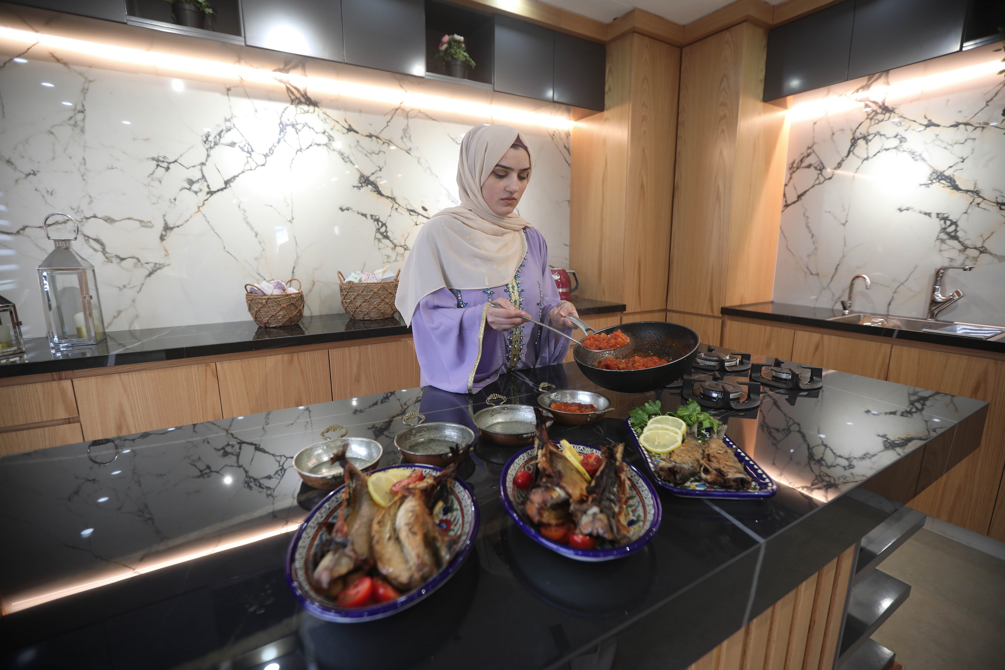 Amani prepares the traditional breakfast for Eid morning in Gaza