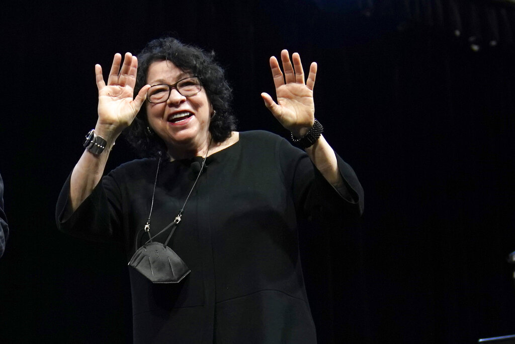 Supreme Court Associate Justice Sonia Sotomayor waves after speaking during an event at Washington University in St. Louis