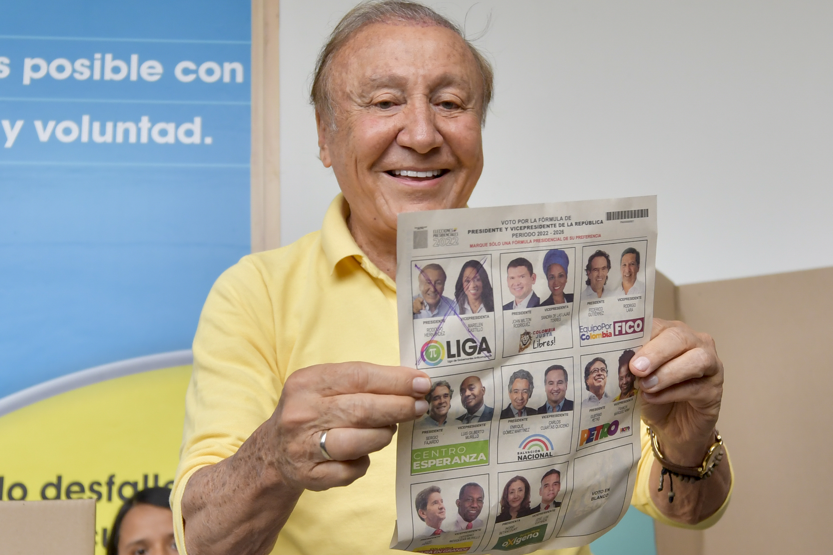 Rodolfo Hernandez, presidential candidate with the Anti-corruption Governors League, shows his ballot before voting in presidential elections in Bucaramanga, Colombia