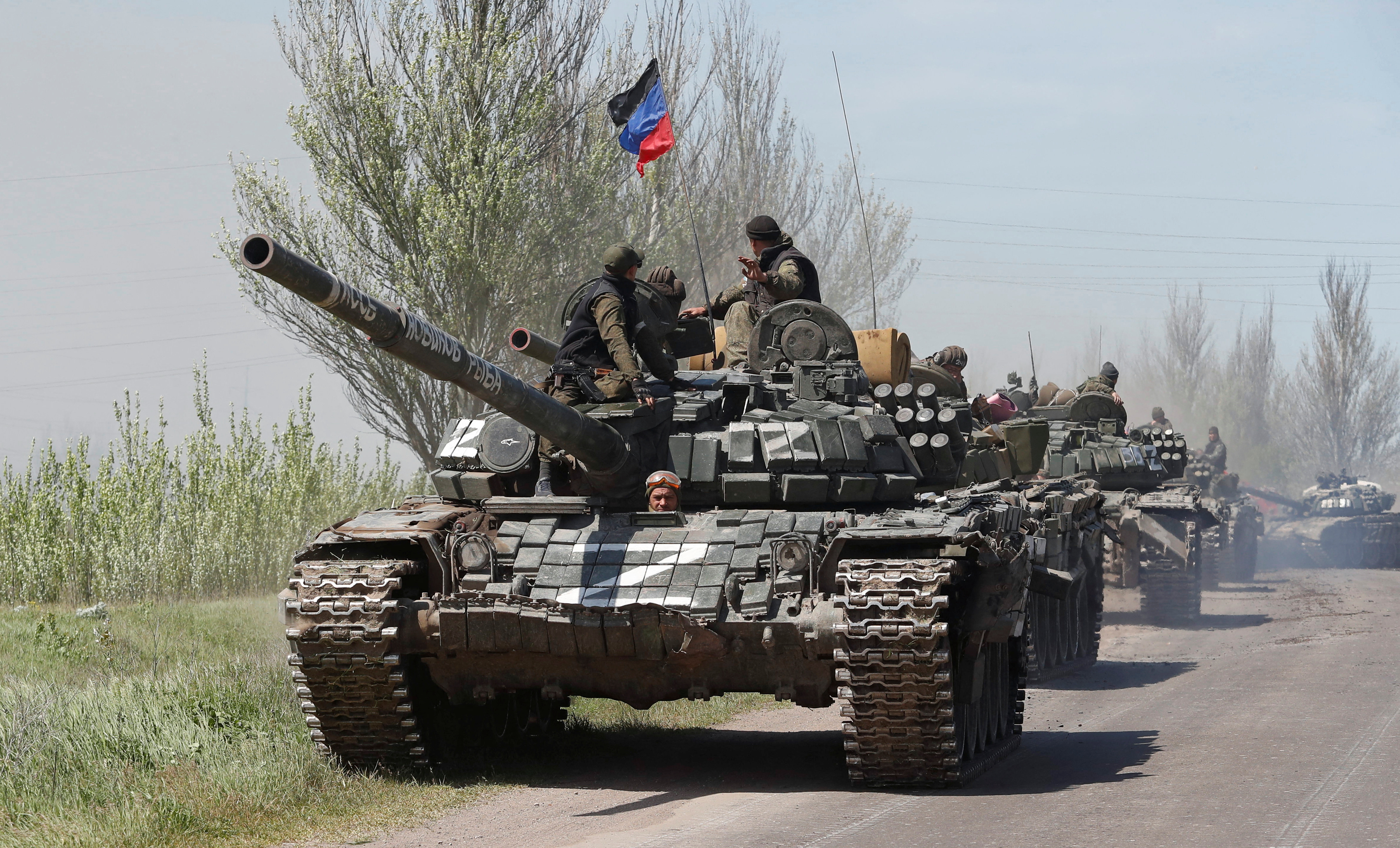 Russian troops drive armoured vehicles near Novoazovsk in the Donetsk region on Friday