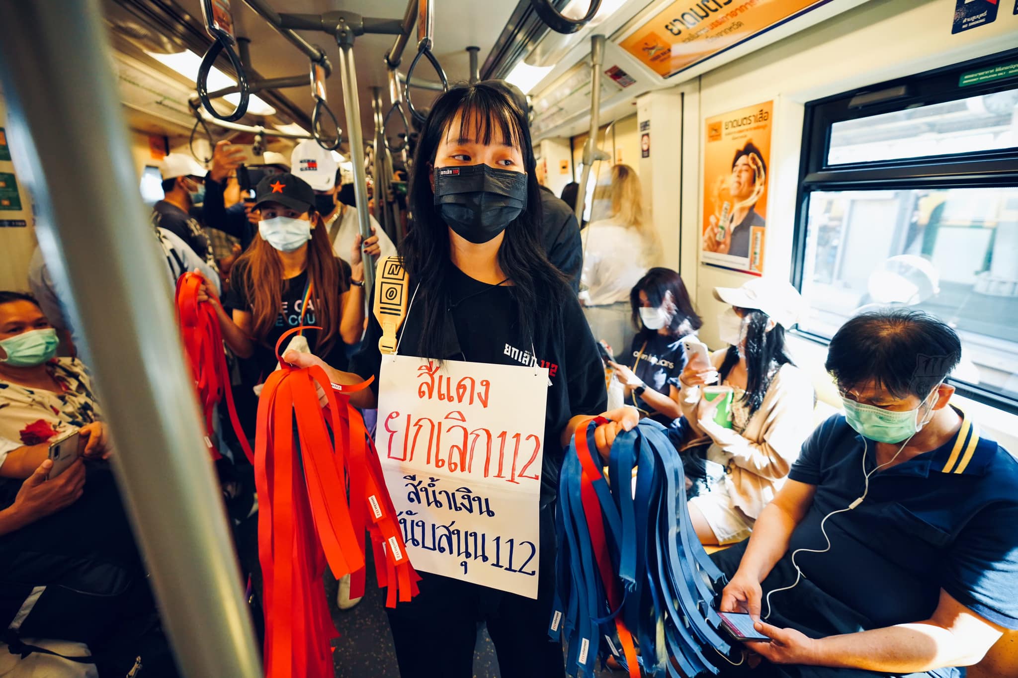 Tawan takes her petition for reform on board a Bangkok metro train