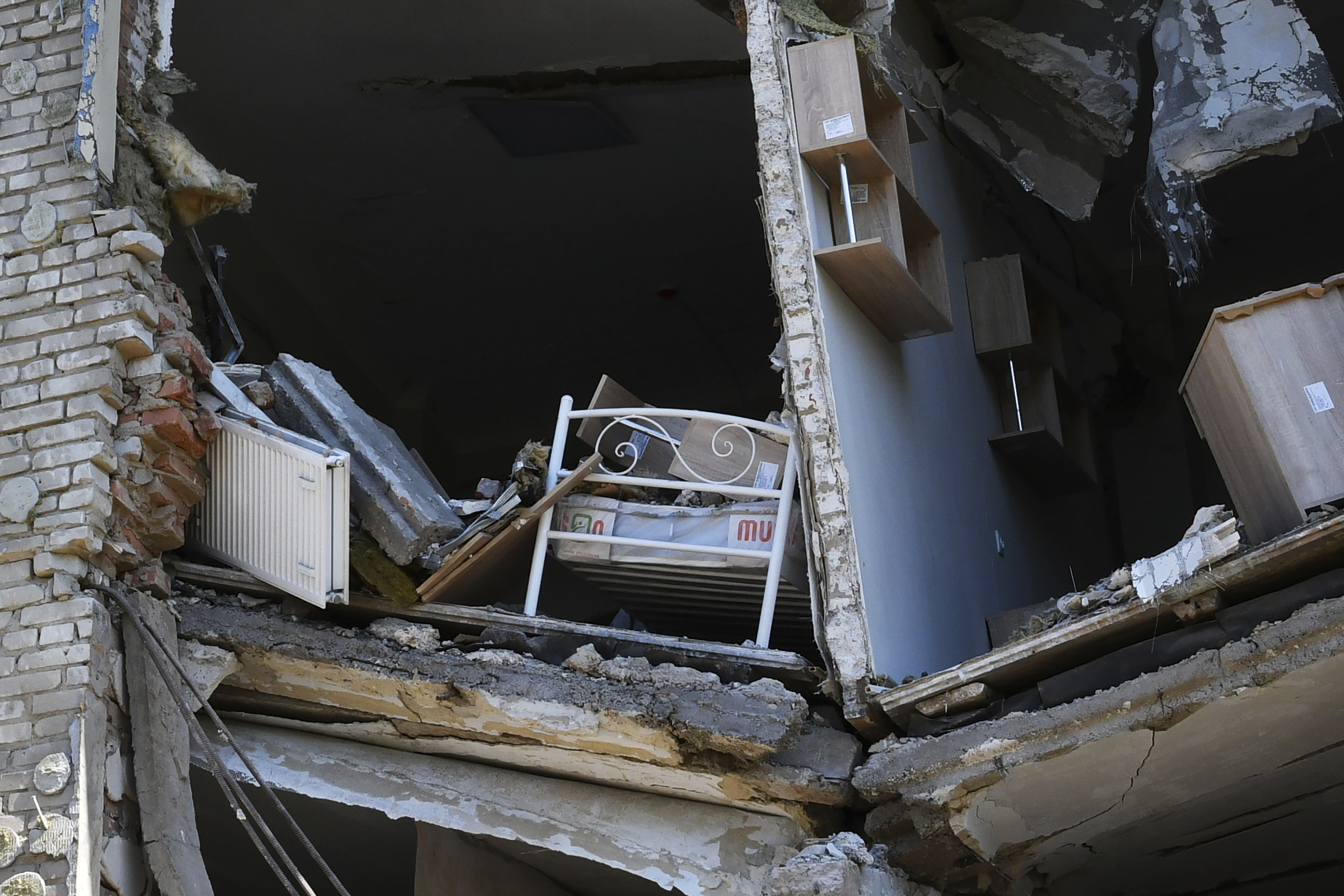 A child's bed inside an apartment building damaged by Russian shelling in Bakhmut, Donetsk region