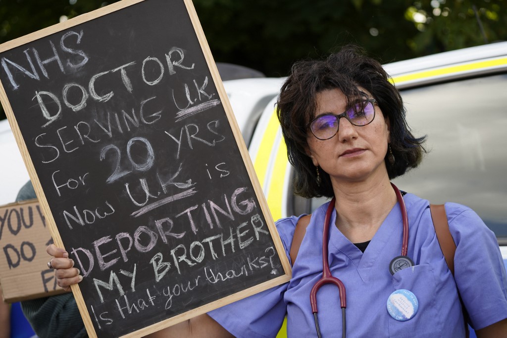 A protester holds up a placard