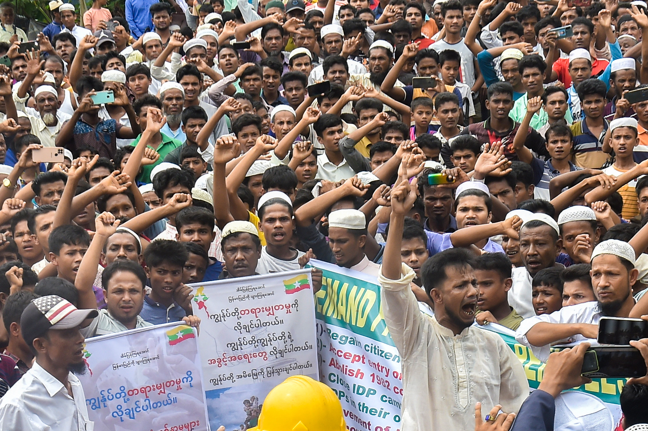 Rohingya refugees walk a "Go home campaign" rally demanding repatriation.