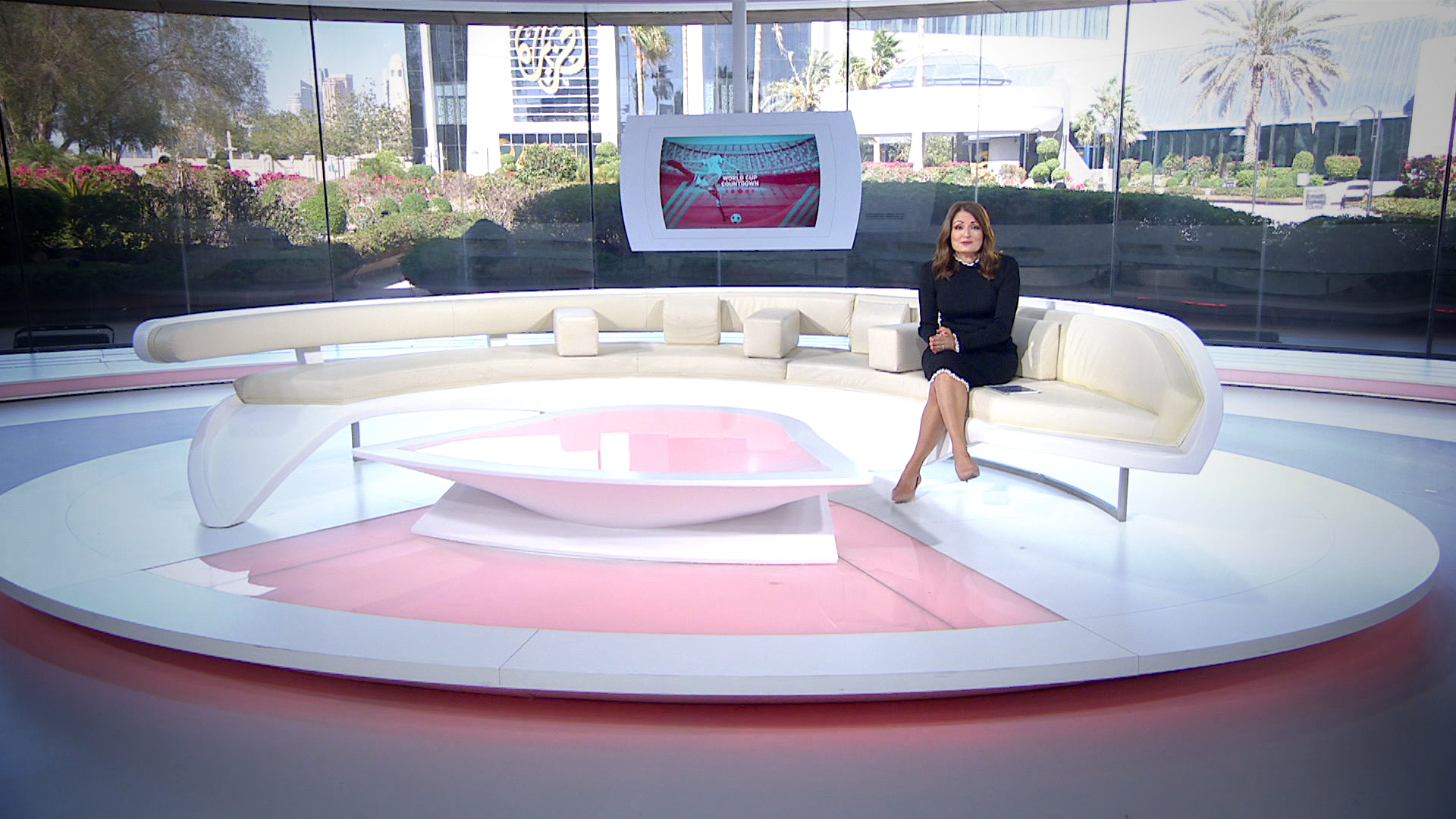 A photo of a woman in a studio.