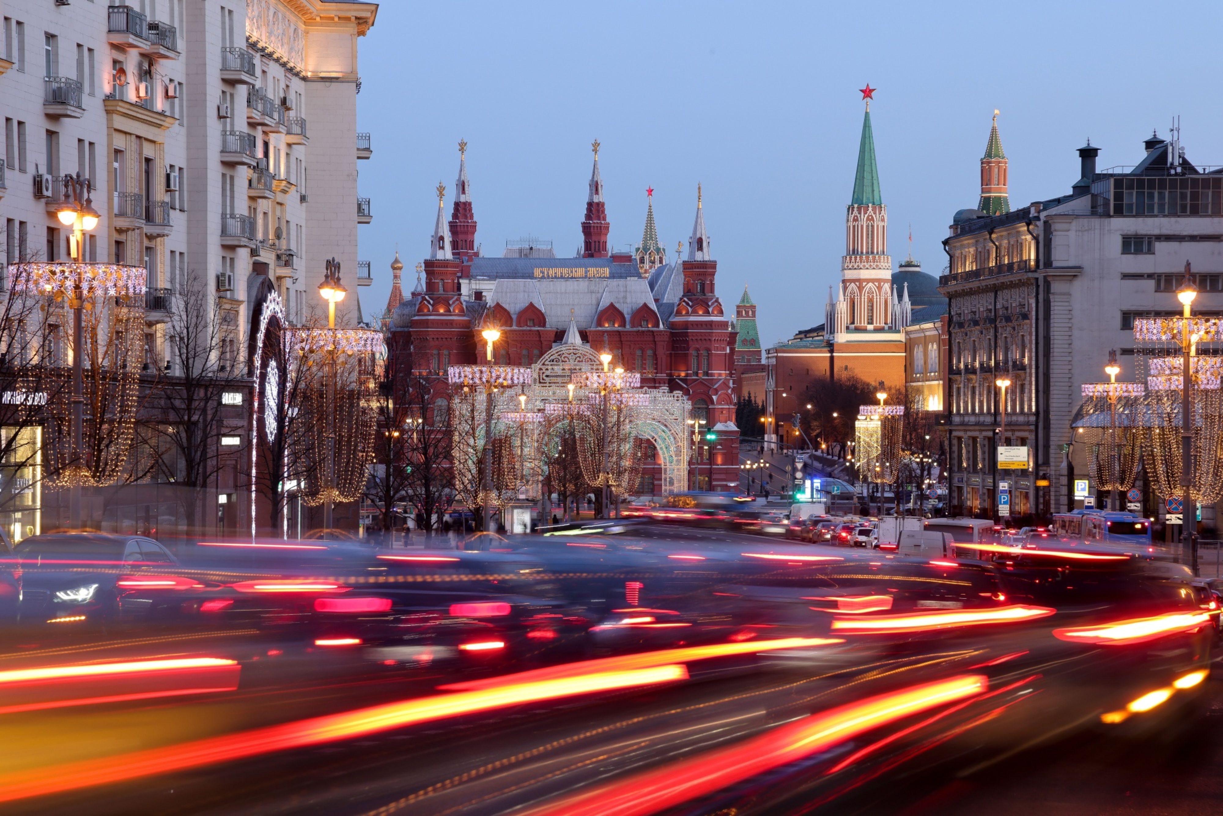 Light trails from heavy traffic on Tverskaya Street by the State Historical Museum in Moscow, Russia
