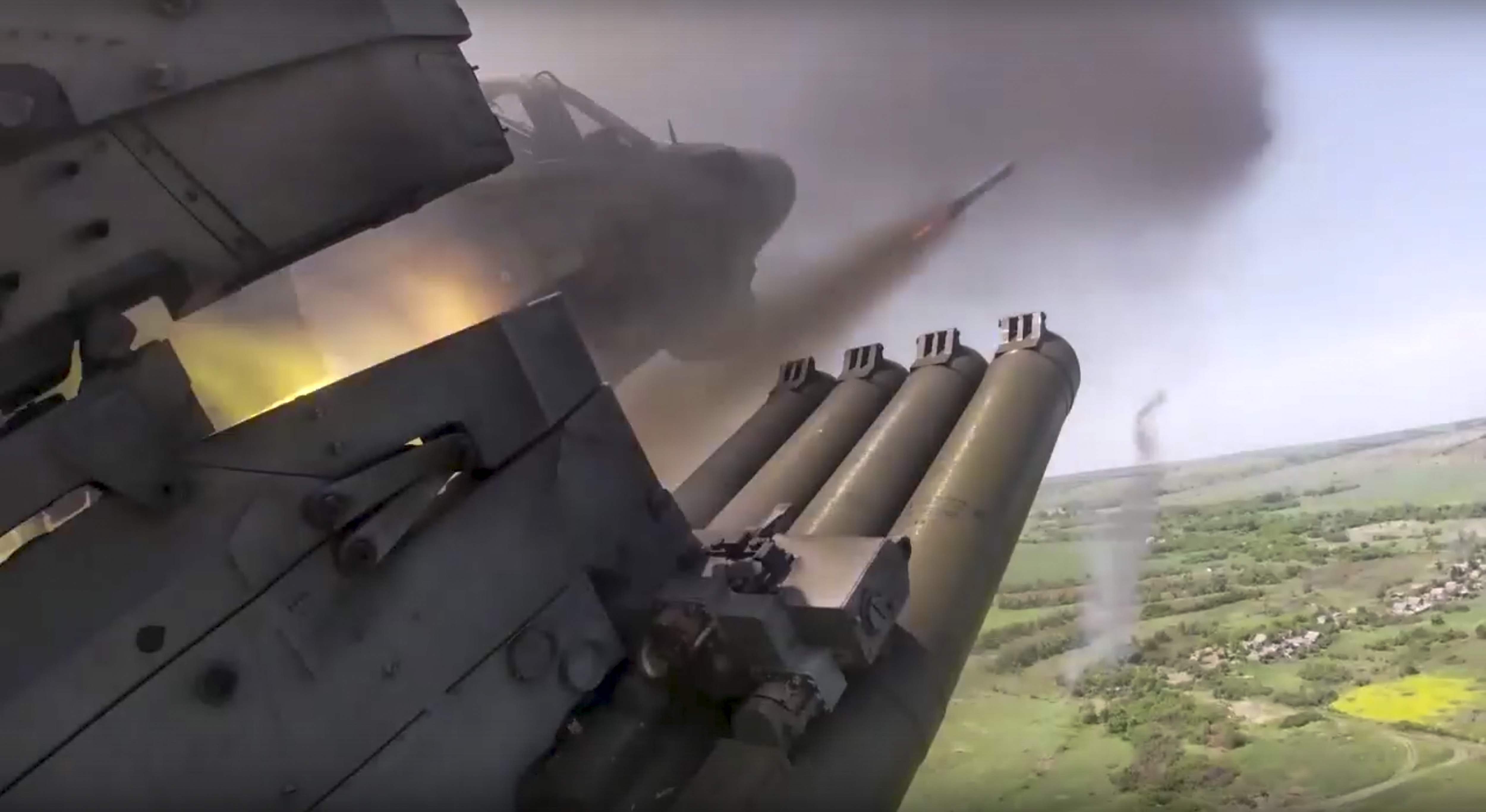 In this photo released by the Russian Defense Ministry Press Service on Saturday, June 18, 2022, a Russian KA-52 helicopter gunship fires rockets on a mission at an undisclosed location in Ukraine. 