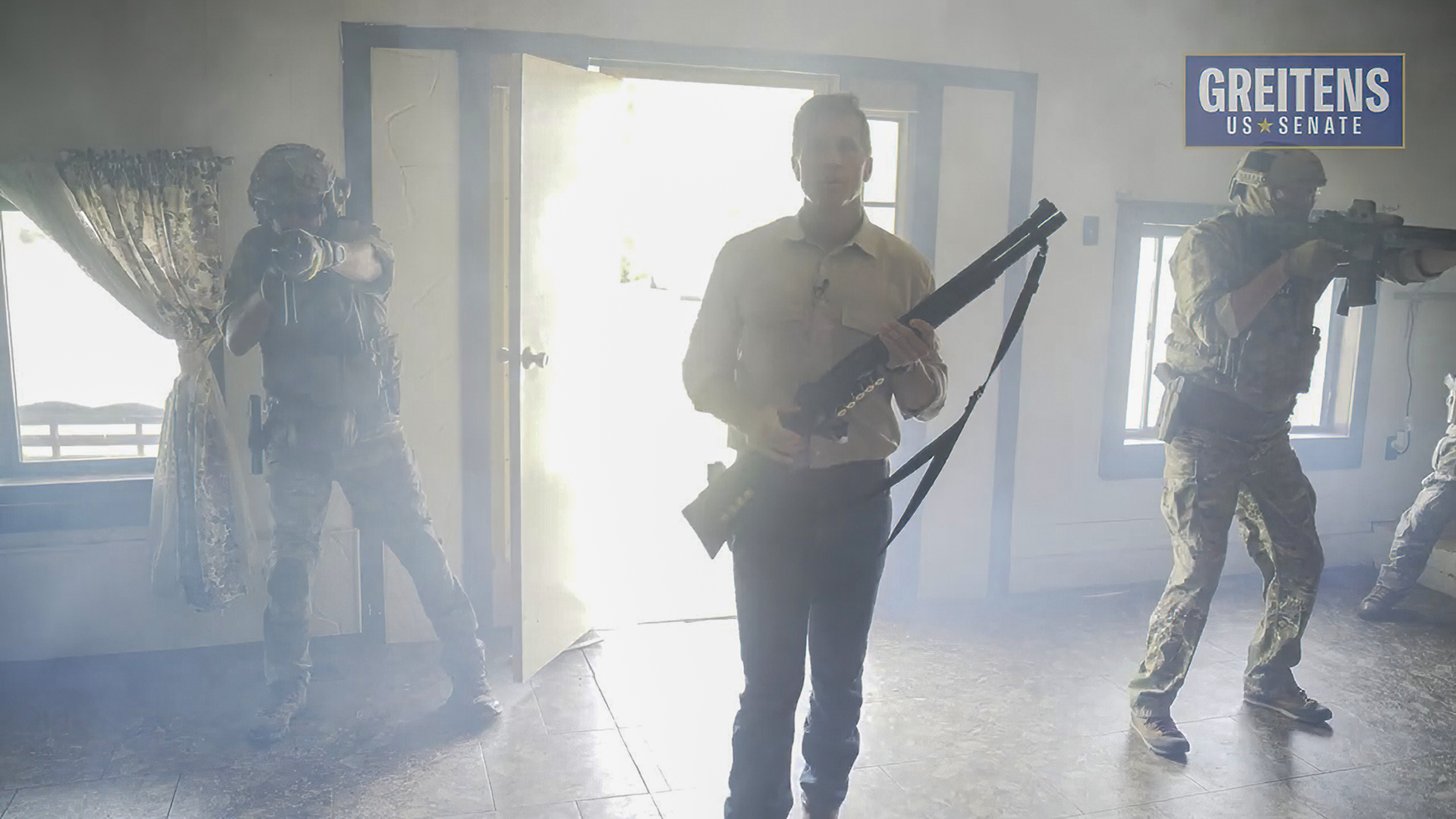 Still image from Eric Greiten campaign ad showing the candidate brandishing a long gun.
