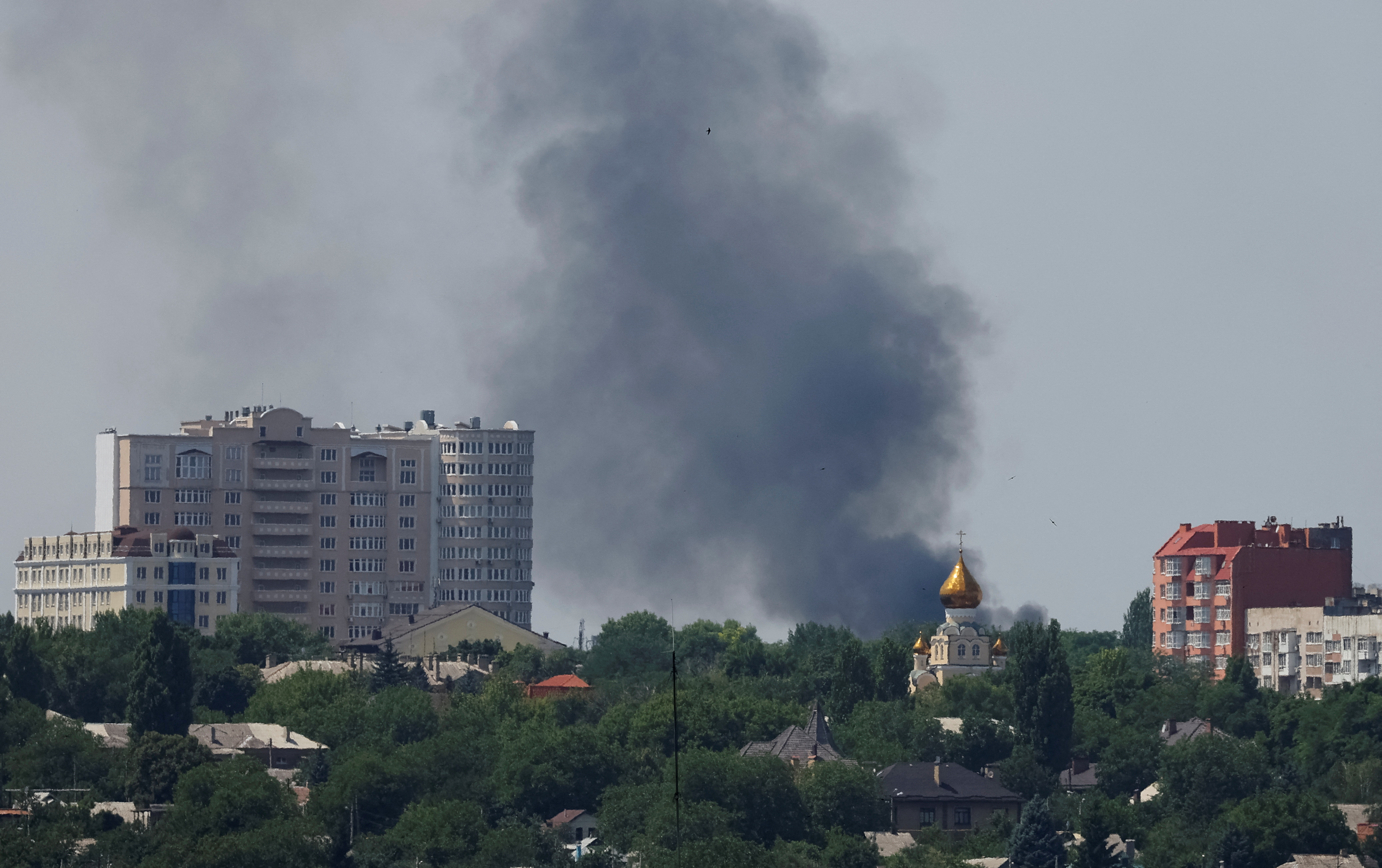 Smoke rises after shelling during Ukraine-Russia conflict in Donetsk, Ukraine on July 6, 2022 [Alexander Ermochenko/Reuters]