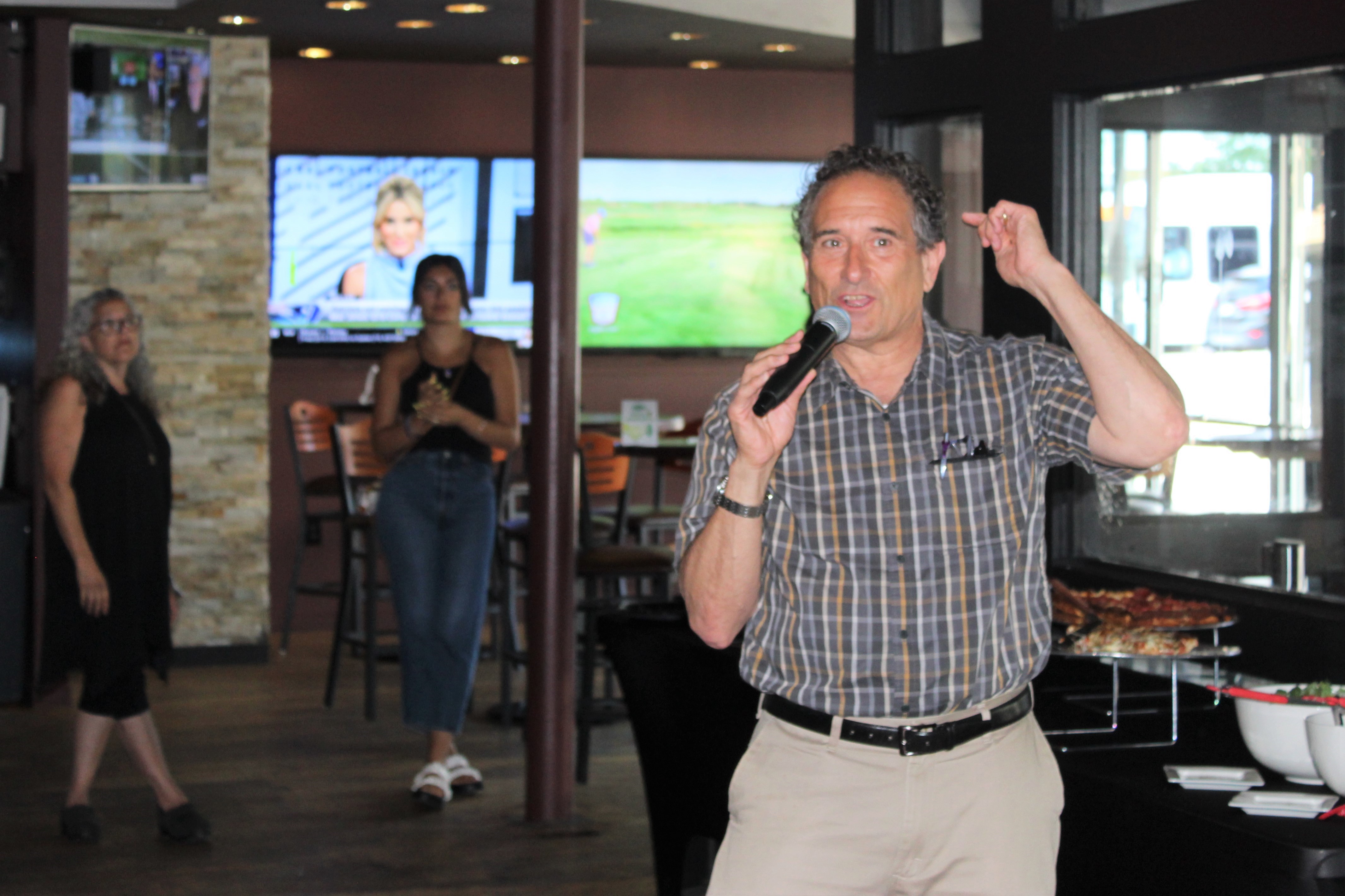 Andy Levin talking to supporters.