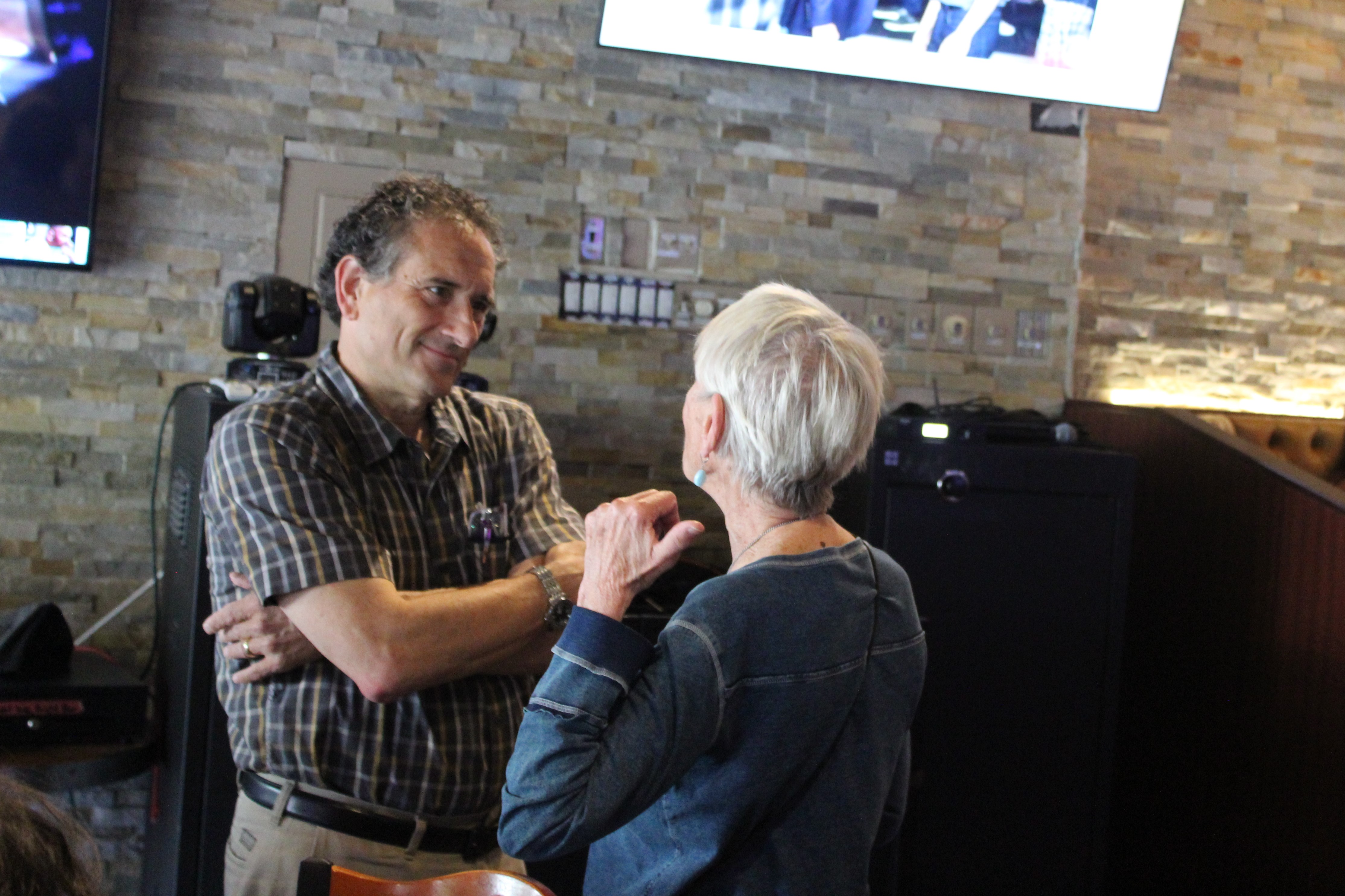 Andy Levin talking with a supporter.