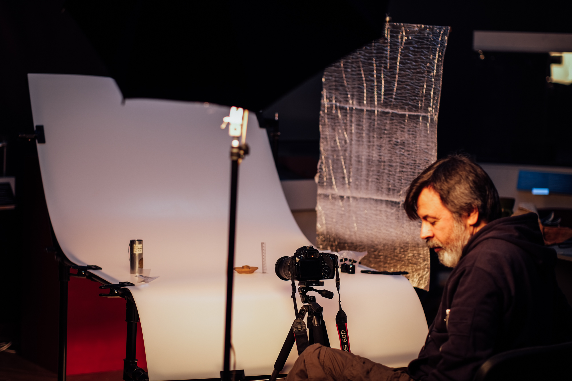 A photo of the National Museum of the History of Ukraine employees recording and logging artifacts.