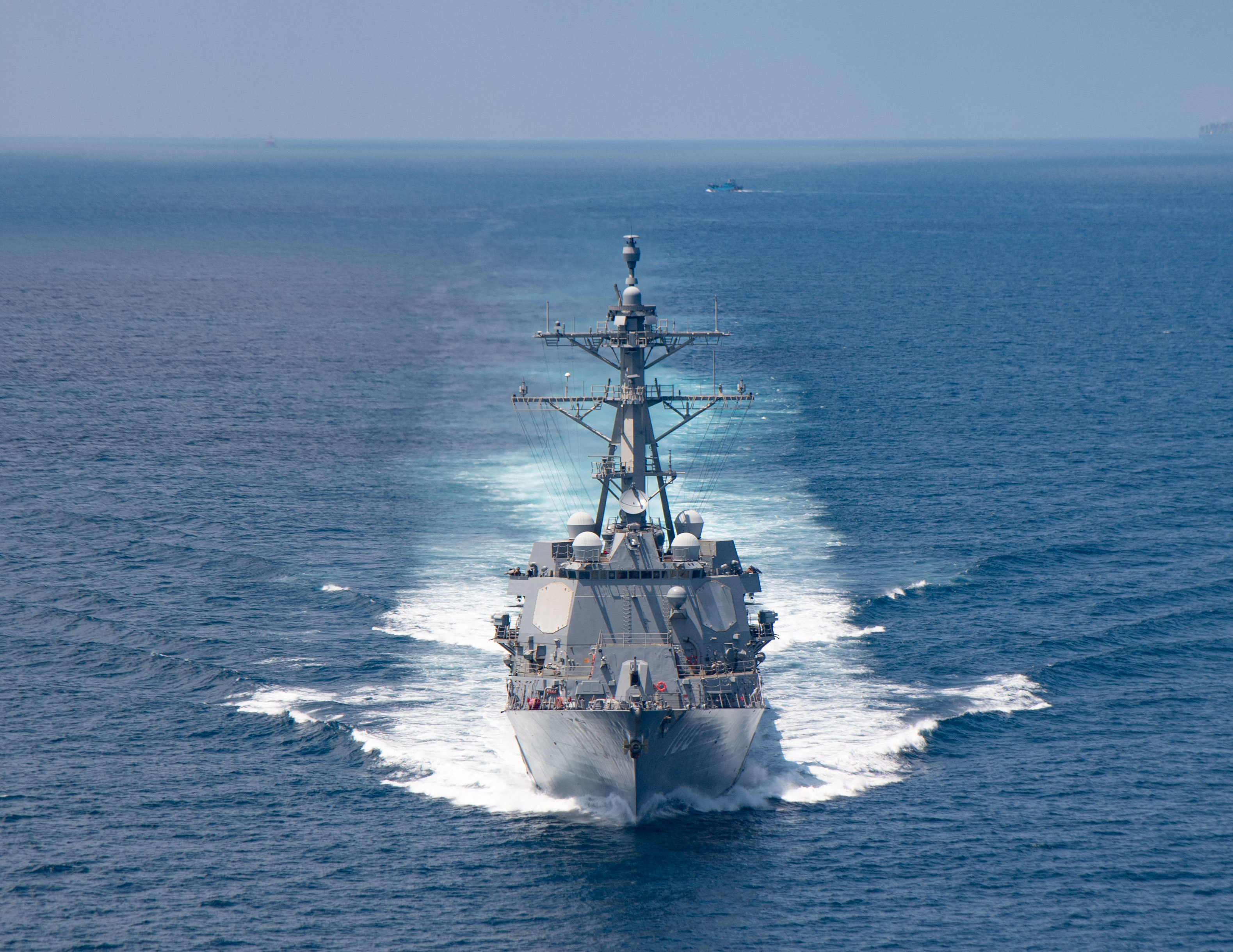 In this handout image courtesy of the US Navy taken on August 27, 2021 the AI Arleigh-burke class guided-missile destroyer USS Kidd (DDG 100) transits the Taiwan Strait during a routine transit