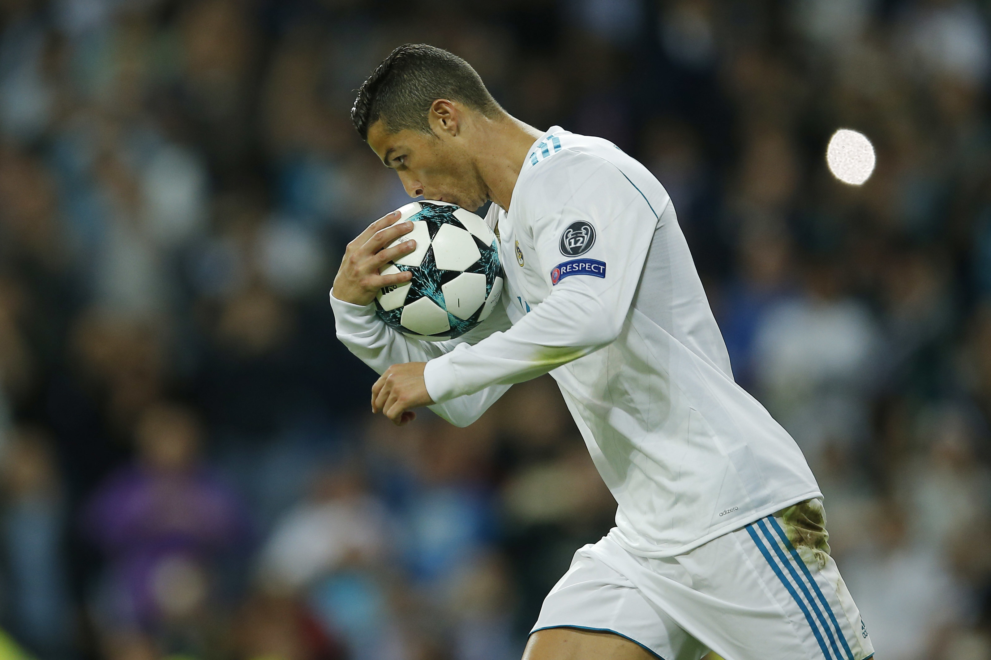 Real Madrids Cristiano Ronaldo jumps for the ball with Malmos Anton Tinnerholm during a Champions League group A soccer match between Real Madrid and Malmo at the Santiago Bernabeu stadium in Madrid, Tuesday, Dec. 8, 2015. (AP Photo/Daniel Ochoa de Olza)