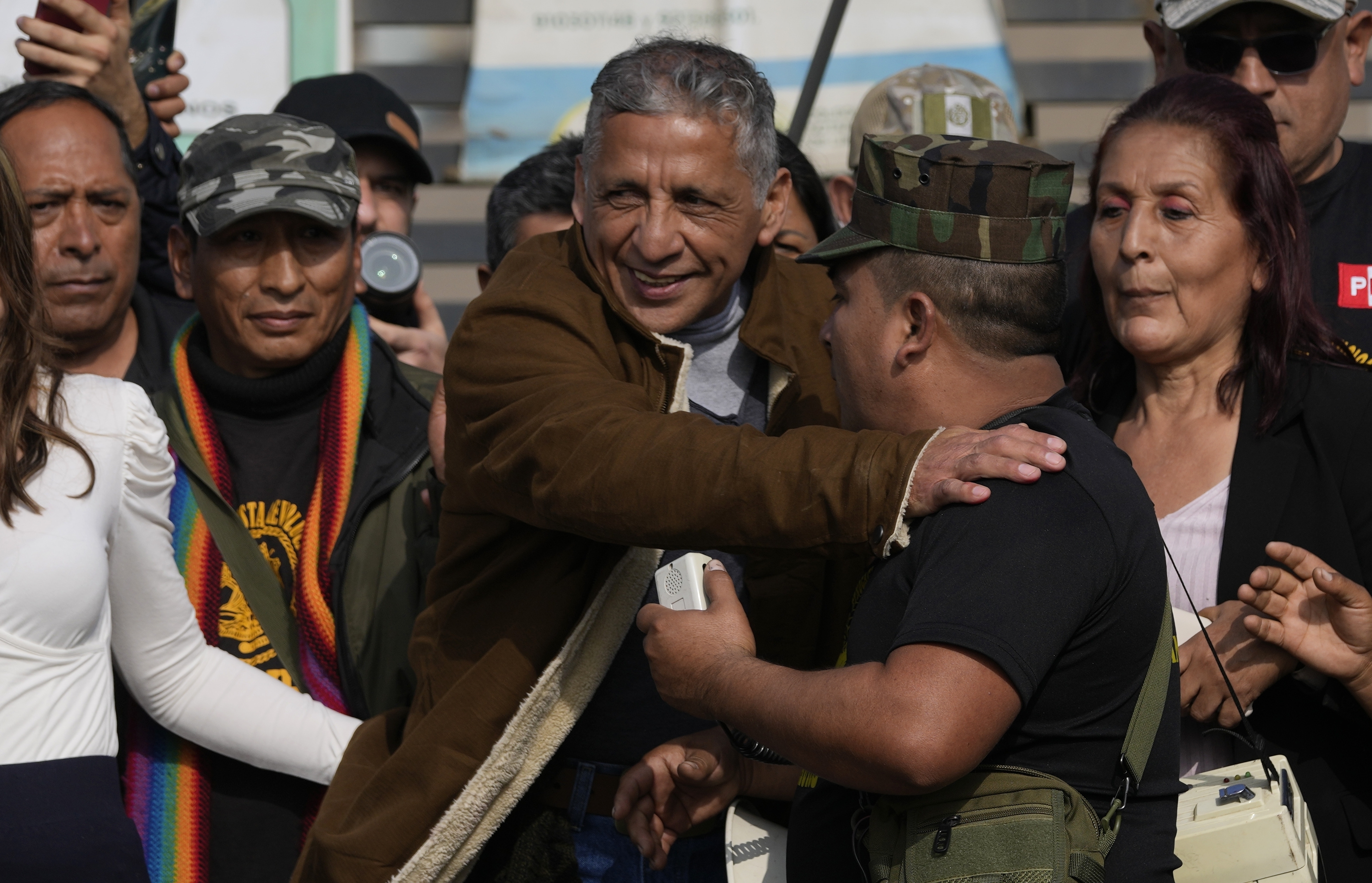 Former Army Major Antauro Humala greets supporters after he was released from prison, on the outskirts of Lima, Peru.