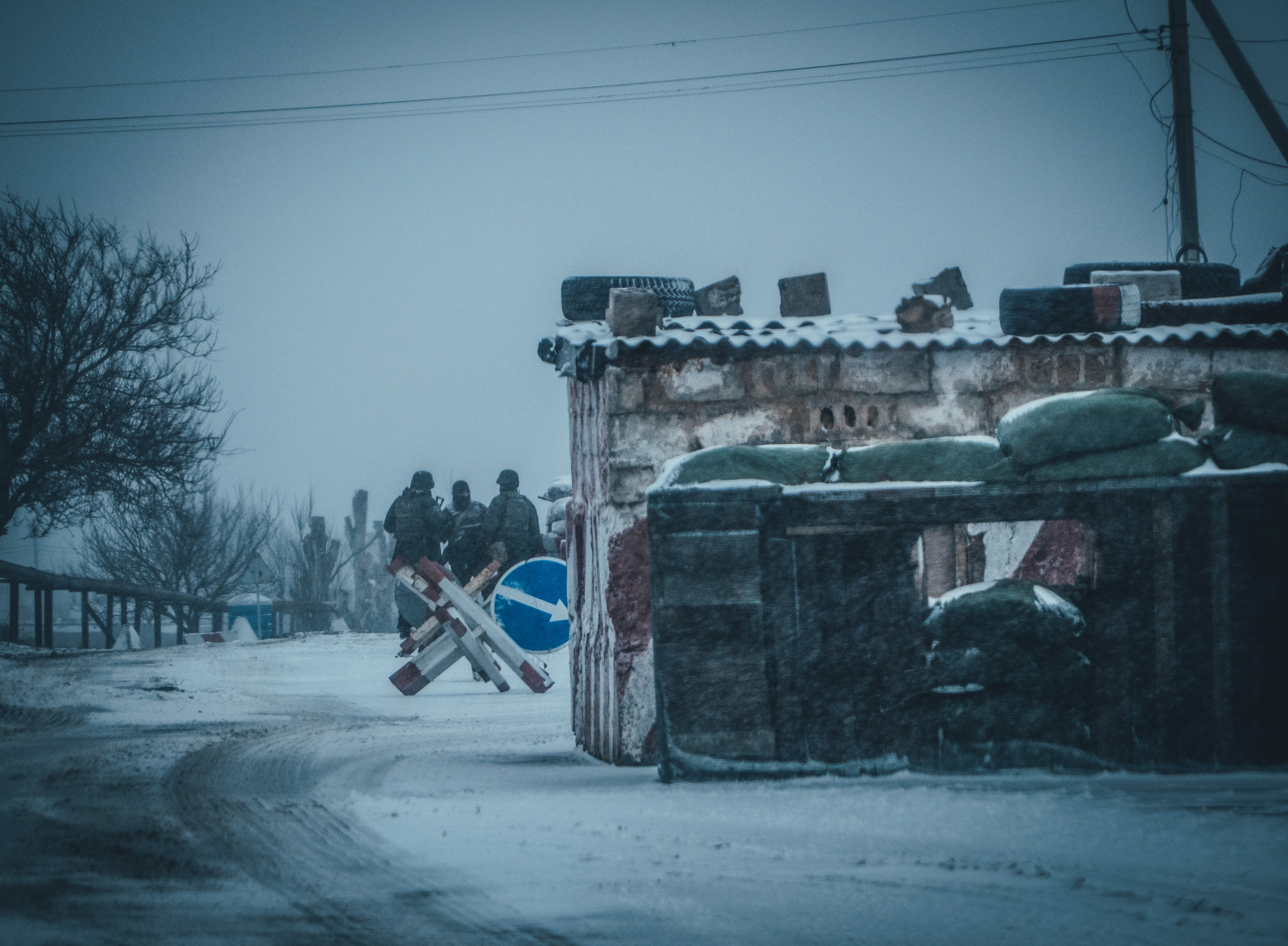 A photo of a building made of metal in snow.