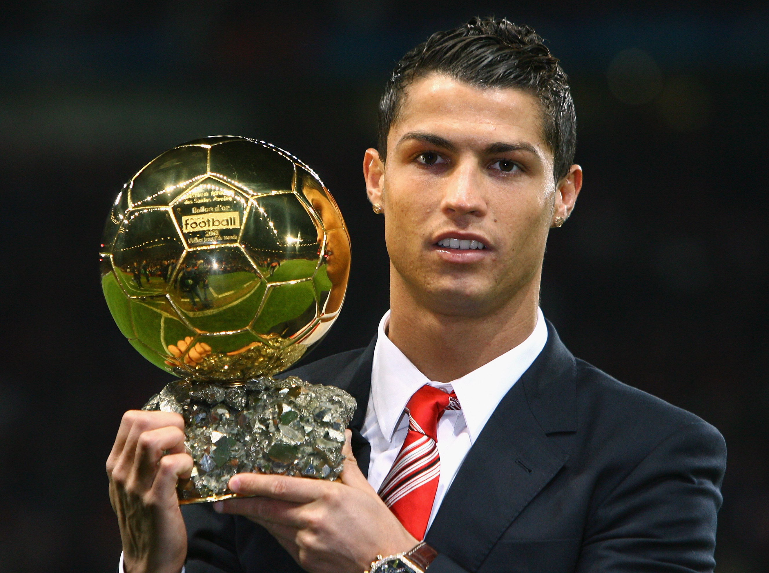 Cristiano Ronaldo of Manchester United receives the Ballon d’or after being voted the European Footballer of the Year before the UEFA Champions League Group E match between Manchester United and Aalborg at Old Trafford on December 10, 2008 in Manchester, England