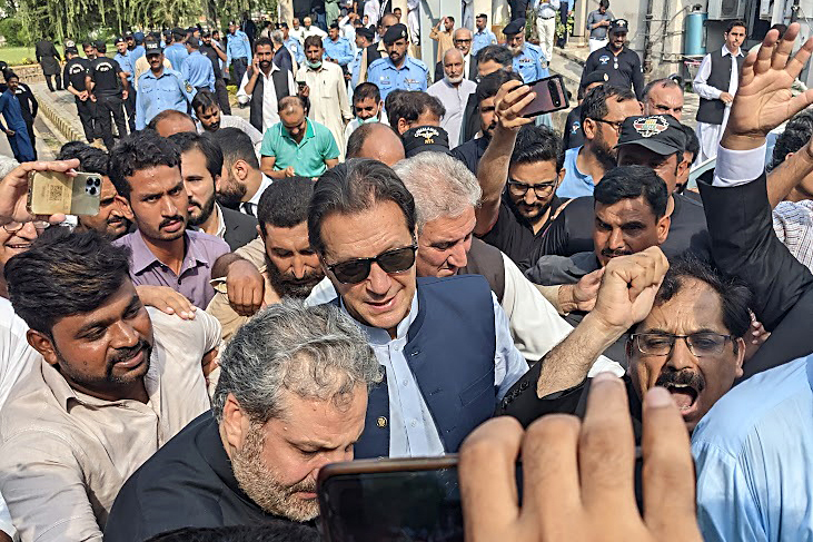 Former Pakistan PM Imran Khan (C)