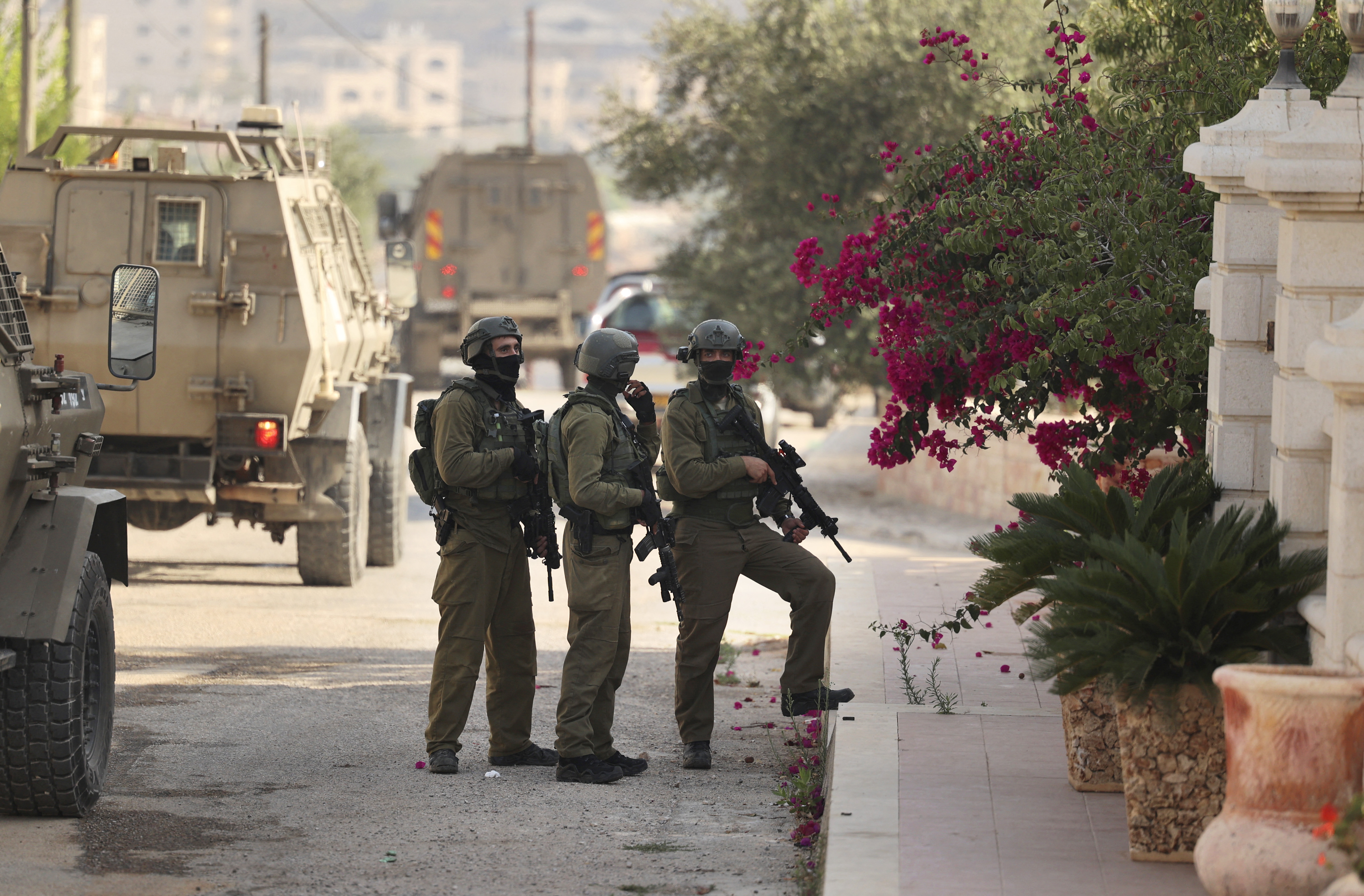 Israeli soldiers keep position during a military operation in the Palestinian town of Silwad, near the city of Ramallah in the occupied West Bank, on August 31, 2022.