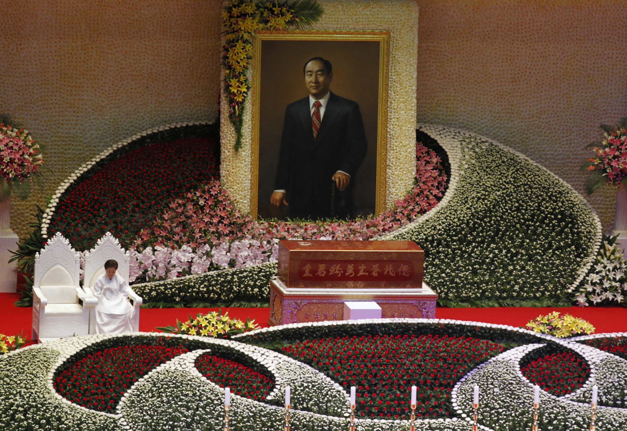Han Hak-ja, widow of Evangelist Reverend Sun-Myung Moon, sits beside the coffin of Moon during a funeral service for the late, founder of the Unification Church, at the CheongShim Peace World Center in Gapyeong