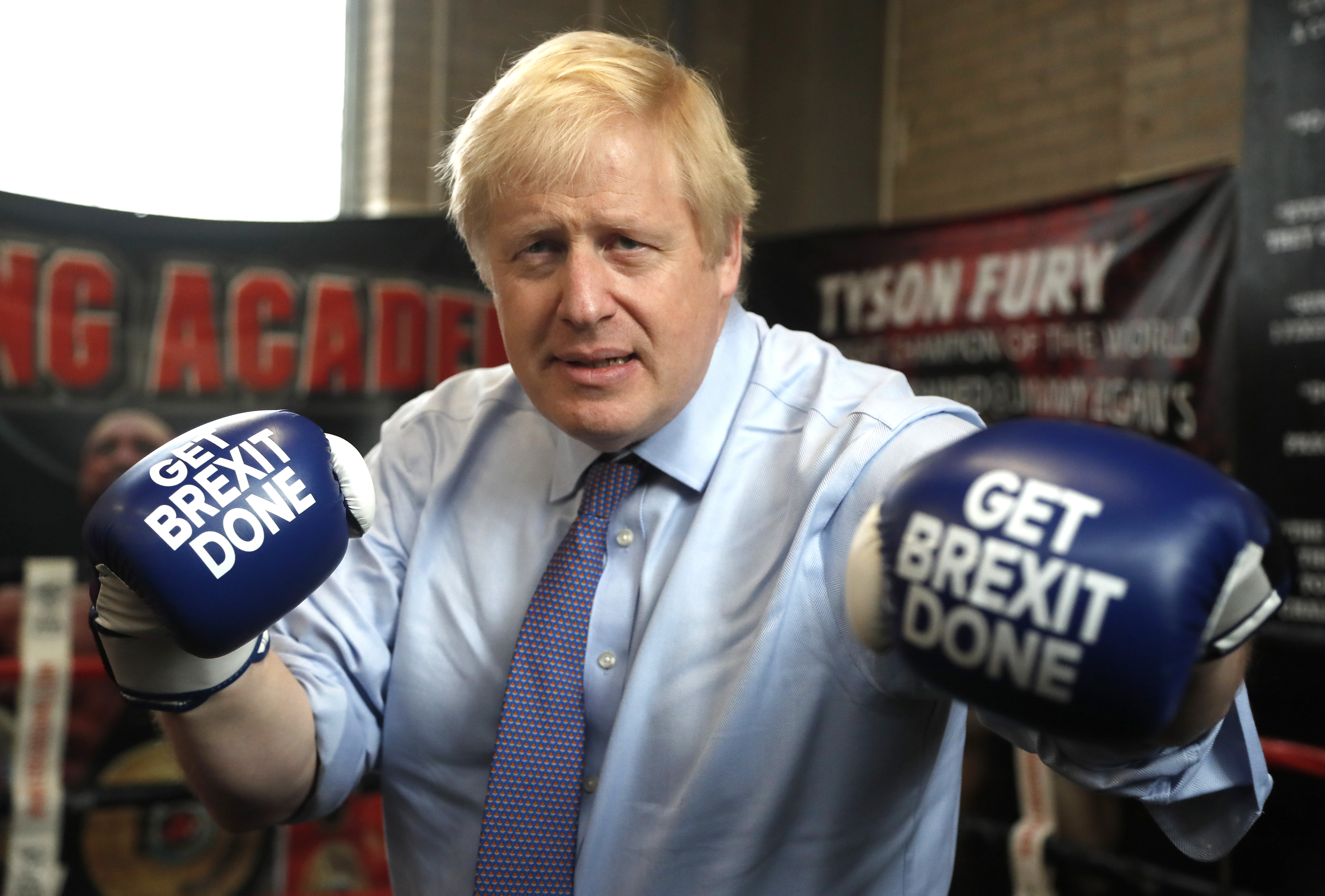 Boris Johnson with boxing gloves reading: Get Brexit done